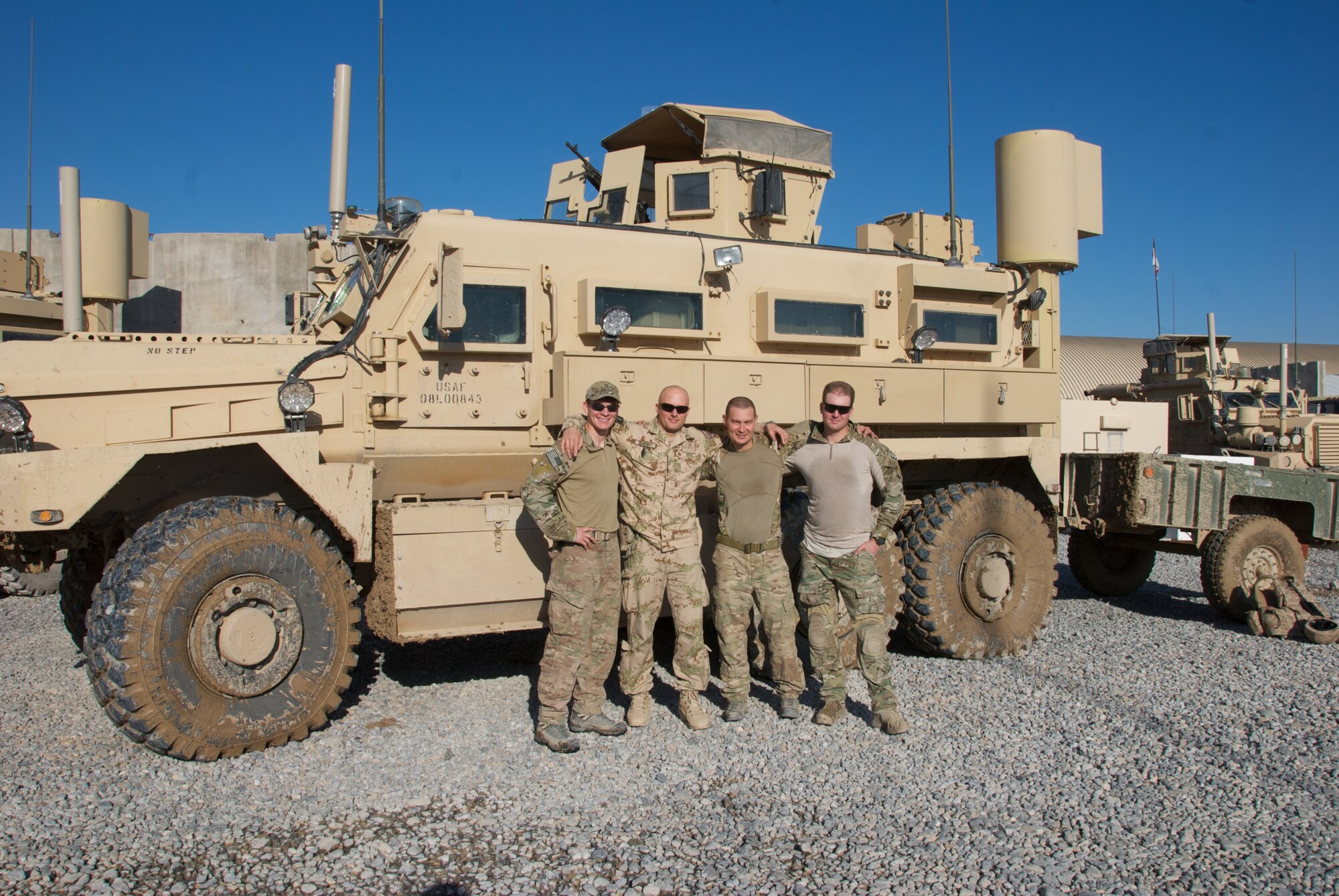 Tech. Sgt. Jeremy Miller, 509th Civil Engineer Squadron NCO in charge of EOD, third from the left, deployed to Southwest Asia from Sept. 1, 2013 to May 1, 2014. Miller deployed with a coalition force and joint force of U.S. Army, U.S. Air Force and Romanian Army Service members to train Afghan soldiers on various EOD techniques as part of a coalition interoperability training mission with the Afghan National Army. (U.S. Air Force photo by Tech. Sgt. Jeremy Miller/Released)