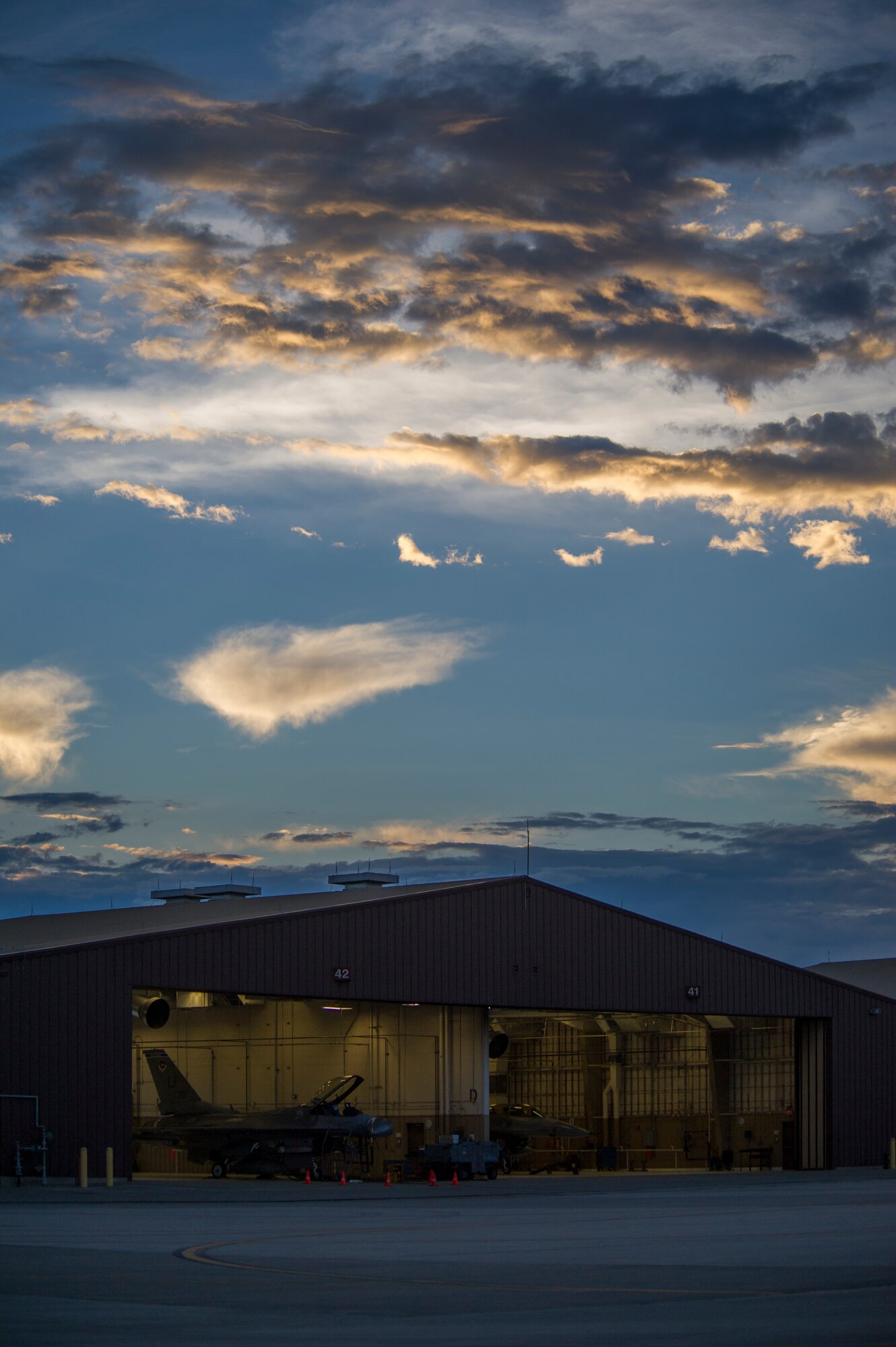 Two F-16 Fighting Falcons from the 54th Fighter Group prepare for a training sortie over the White Sands Missile Range's 10,000 square mile range at Holloman Air Force Base, N.M., Aug. 6. The 54th FG is a detachment of Luke AFB, Ariz., and is stationed on Holloman to facilitate high-speed training, live fire weapons training, and night flying operations. (U.S. Air Force photo by Airman 1st Class Aaron Montoya / Released)
