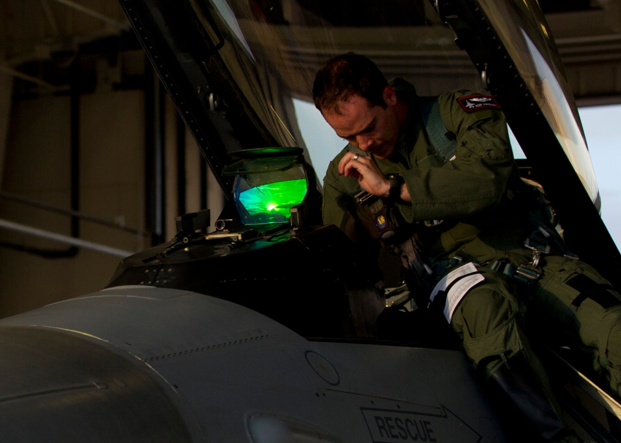 Captain Jake Pippenger, 54th Fighter Group pilot, enters the cockpit of an F-16 Fighting Falcon prior to a training sortie over the White Sands Missile Range's 10,000 square mile range at Holloman Air force Base, N.M., Aug. 5. The 54th FG is a detachment of Luke AFB, Ariz., and is stationed on Holloman to facilitate high-speed training, live fire weapons training, and night flying operations. (U.S. Air Force photo by Airman 1st Class Leah Ferrante/Released)