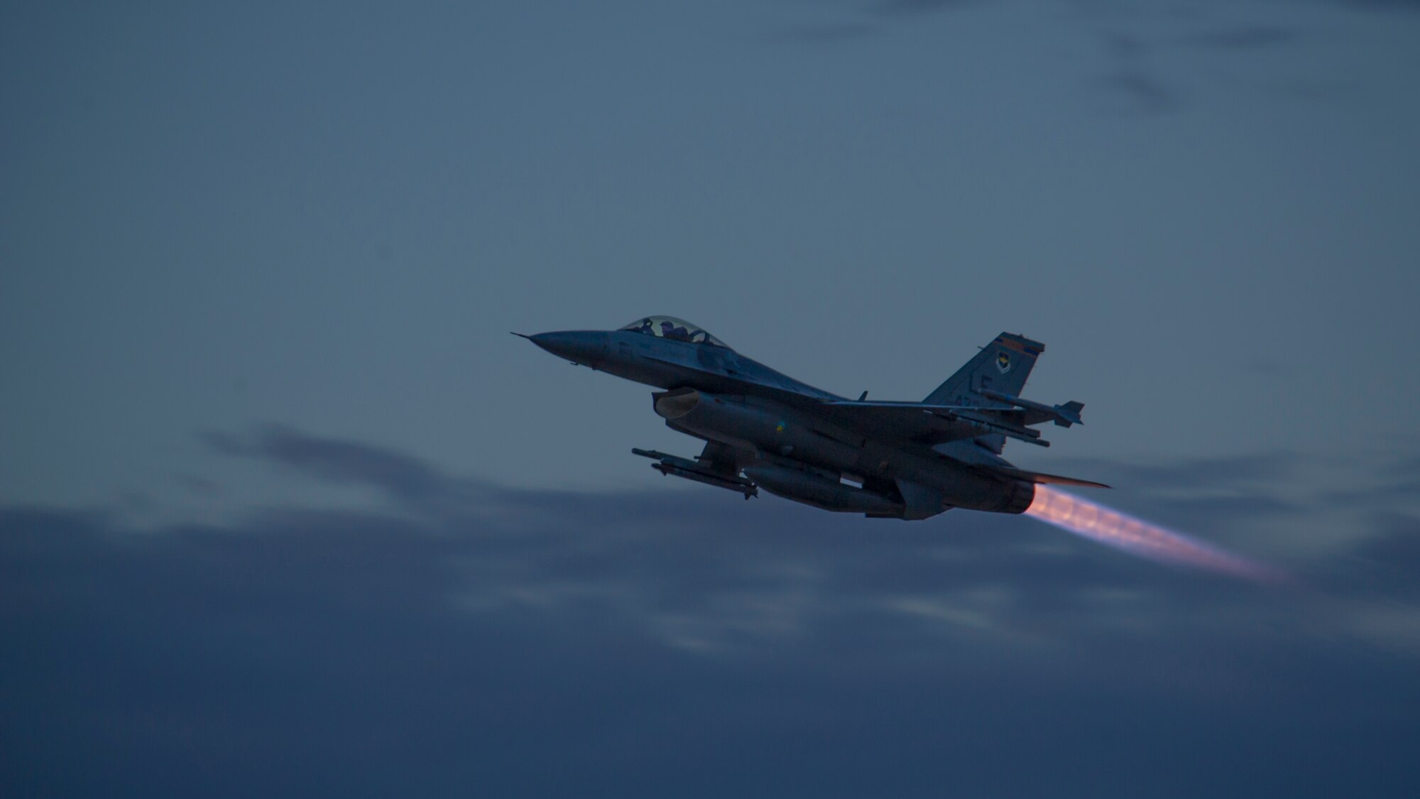 An F-16 Fighting Falcon takes off to participate in a night flying sortie at Holloman Air Force Base, N.M., Aug. 6. F-16 Fighting Falcons from the 54th Fighter Group train over the White Sands Missile Range's 10,000 square mile range. The 54th FG is a detachment of Luke AFB, Ariz., and is stationed on Holloman to facilitate high-speed training, live fire weapons training, and night flying operations. (U.S. Air Force photo by Airman 1st Class Aaron Montoya / Released)