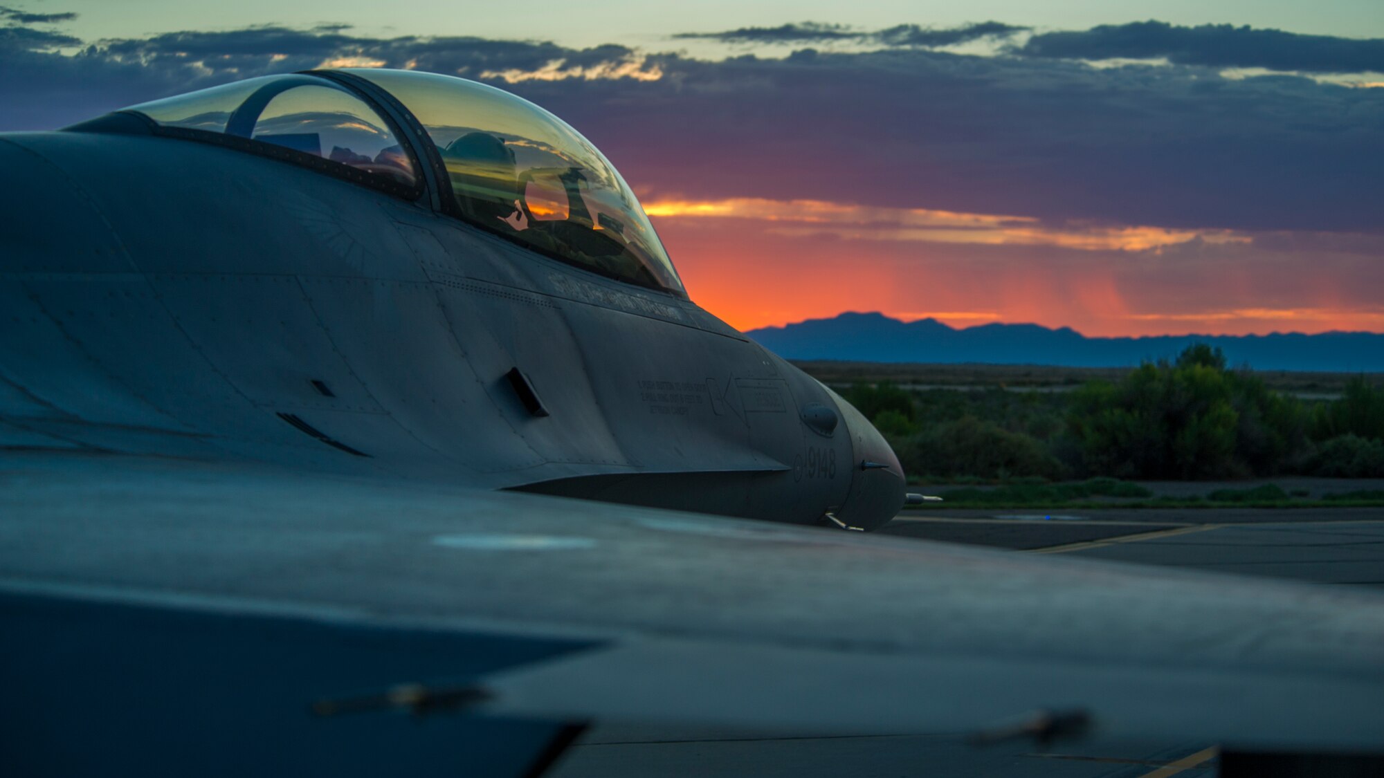 A 54th Fighter Group pilot prepares for takeoff during a night flying training sortie at Holloman Air Force Base, N.M., Aug. 6. F-16 Fighting Falcons from the 54th Fighter Group train over the White Sands Missile Range's 10,000 square mile range. The 54th FG is a detachment of Luke AFB, Ariz., and is stationed on Holloman to facilitate high-speed training, live fire weapons training, and night flying operations. (U.S. Air Force photo by Airman 1st Class Aaron Montoya / Released)