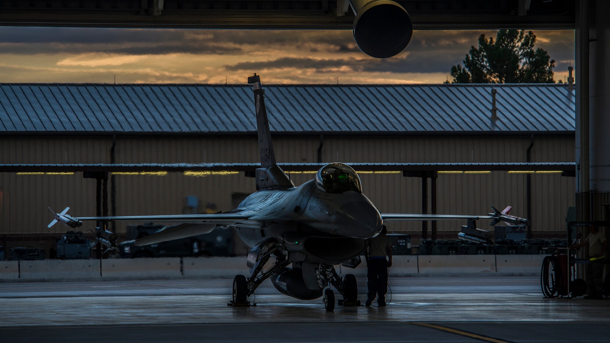 A 54th Fighter Group crew chief prepares for a night flying training sortie at Holloman Air Force Base, N.M., Aug. 6. F-16 Fighting Falcons from the 54th Fighter Group train over the White Sands Missile Range's 10,000 square mile range. The 54th FG is a detachment of Luke AFB, Ariz., and is stationed on Holloman to facilitate high-speed training, live fire weapons training, and night flying operations. (U.S. Air Force photo by Airman 1st Class Aaron Montoya / Released)
