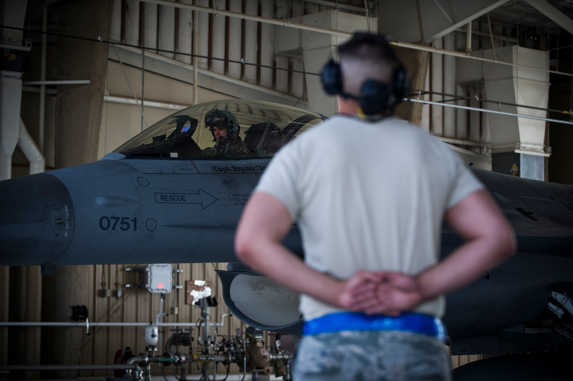 Captain John Widmer, 54th Fighter Group pilot, performs pre-flight checks prior to a training sortie over the White Sands Missile Range's 10,000 square mile range at Holloman Air Force Base, N.M., Aug. 5. The 54th FG is a detachment of Luke AFB, Ariz., and is stationed on Holloman to facilitate high-speed training, live fire weapons training, and night flying operations. (U.S. Air Force photo by Airman 1st Class Aaron Montoya / Released)
