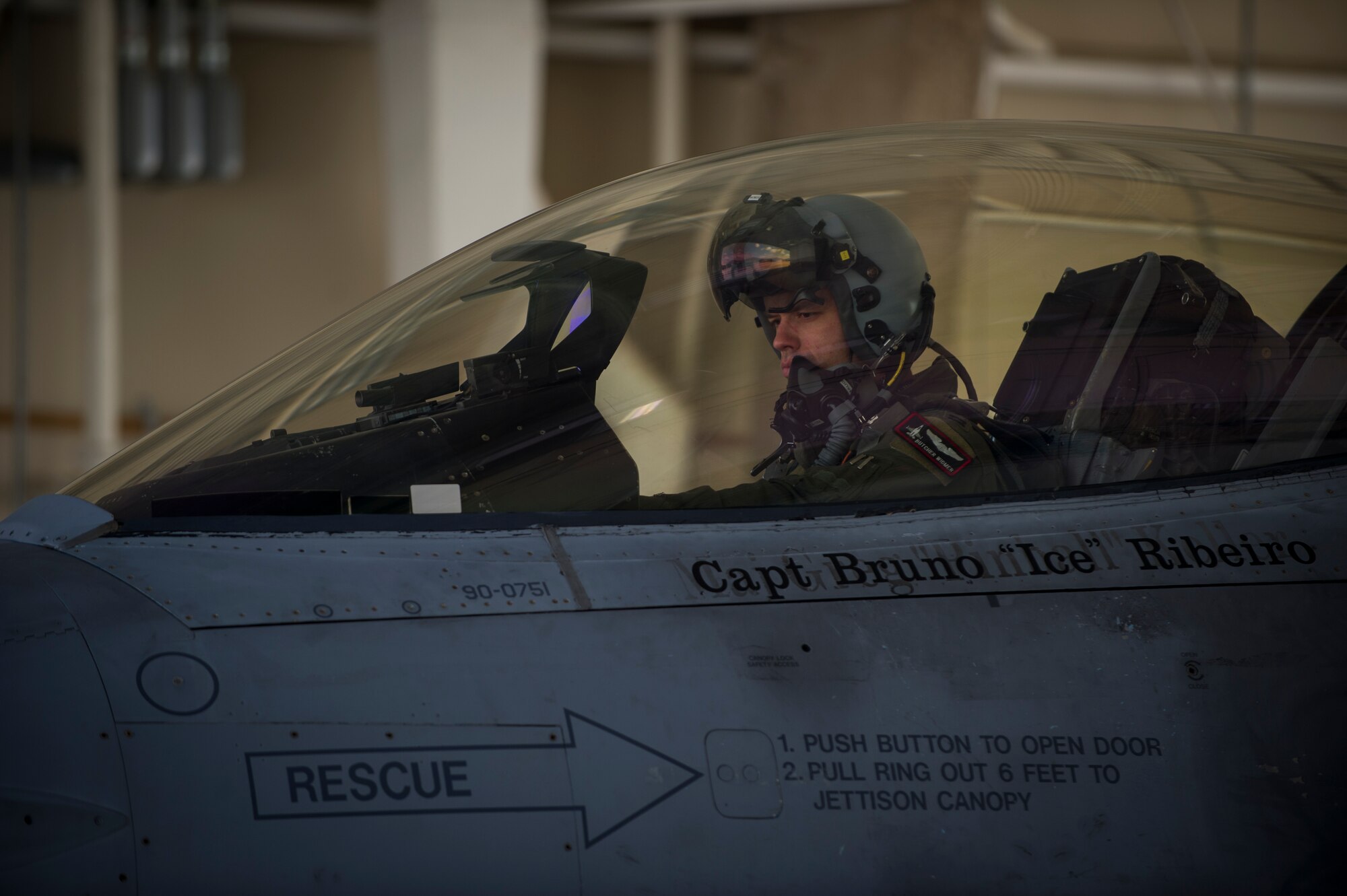 Captain John Widmer, 54th Fighter Group pilot, performs pre-flight checks prior to a training sortie over the White Sands Missile Range's 10,000 square mile range at Holloman Air Force Base, N.M., Aug. 5. The 54th FG is a detachment of Luke AFB, Ariz., and is stationed on Holloman to facilitate high-speed training, live fire weapons training, and night flying operations. (U.S. Air Force photo by Airman 1st Class Aaron Montoya / Released)