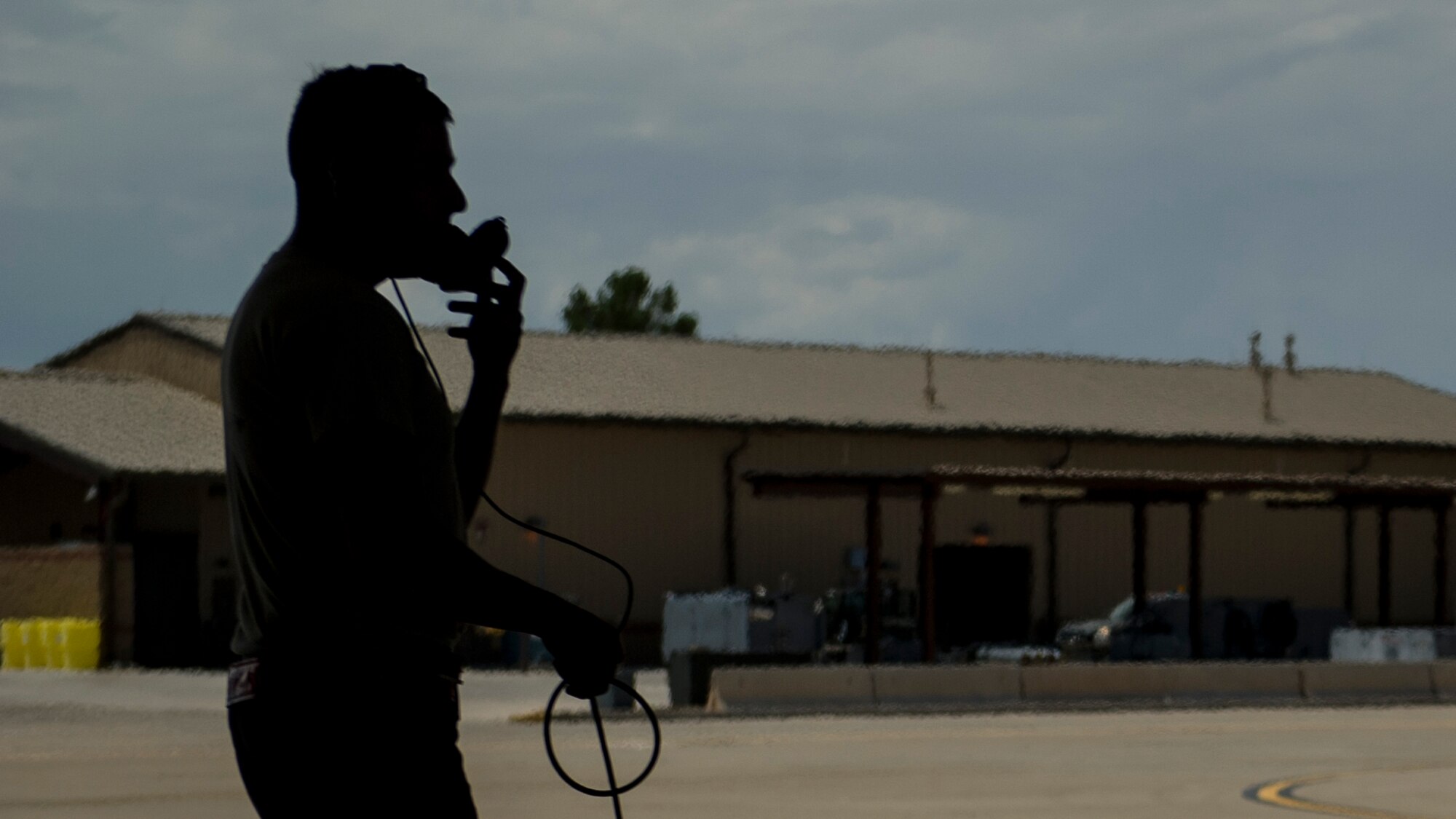 Senior Airman Ramiro Gamero, 54th Fighter Group crew chief, speaks to an F-16 Fighting Falcon pilot as they prepare for a training sortie over the White Sands Missile Range's 10,000 square mile range at Holloman Air Force Base, N.M., Aug 5. The 54th FG is a detachment of Luke AFB, Ariz., and is stationed on Holloman to facilitate high-speed training, live fire weapons training, and night flying operations. (U.S. Air Force photo by Airman 1st Class Aaron Montoya / Released)