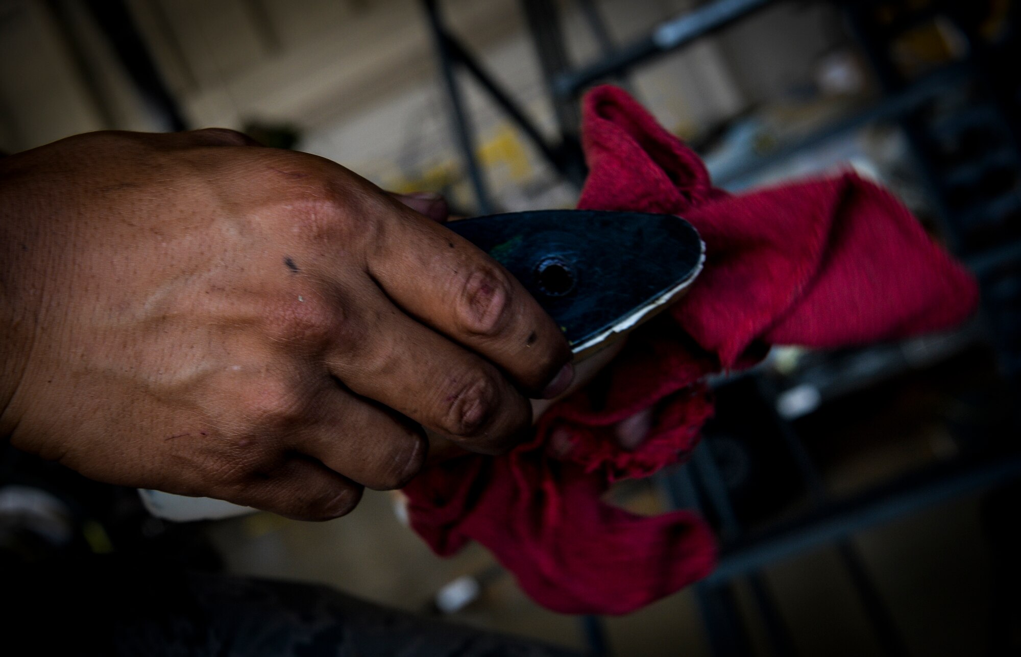 Senior Airman Richard Kodama, 8th Aircraft Maintenance Unit crew chief, cleans an aircraft part on Hurlburt Field, Fla., Aug. 8, 2014. Kodama made sure the CV-22 Osprey was inspection ready. (U.S. Air Force photo/Senior Airman Christopher Callaway) 