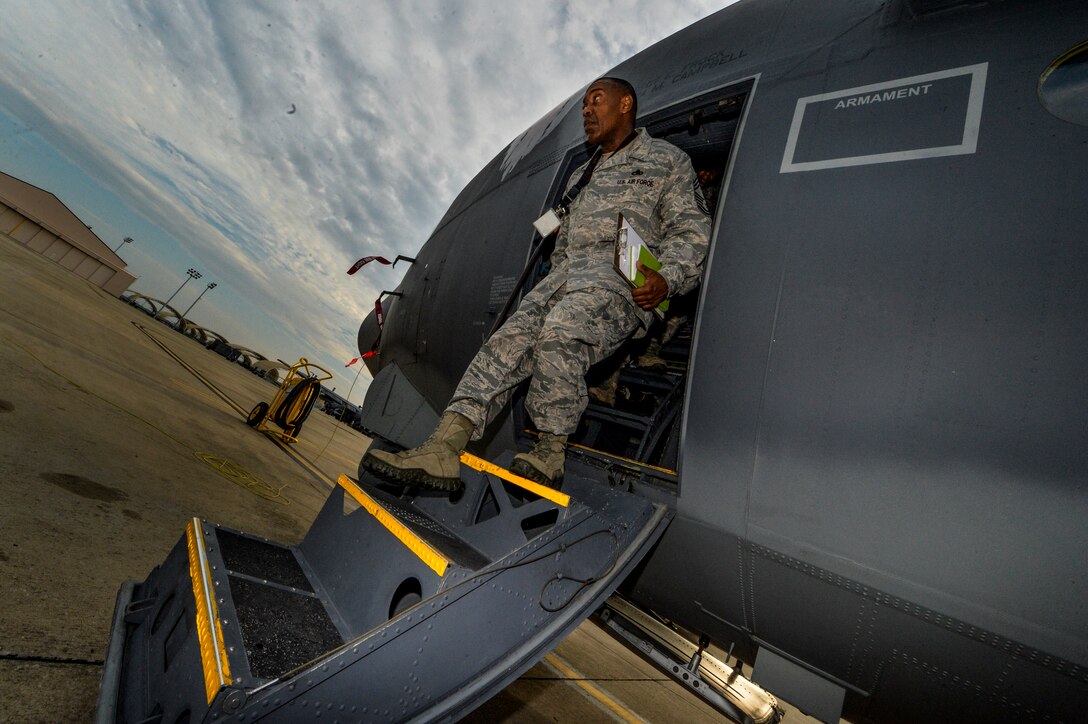 Chief Master Sgt. Raymond Thomas, 1st Special Operations Component Maintenance Squadron chief enlisted manager, steps out of an AC-130U Spooky Gunship on Hurlburt Field, Fla., Aug. 1, 2014. The heavily armed Spooky incorporates side-firing weapons integrated with sensors, navigation and fire control systems to provide firepower during extended periods, at night and in adverse weather. (U.S. Air Force photo/Senior Airman Christopher Callaway) 