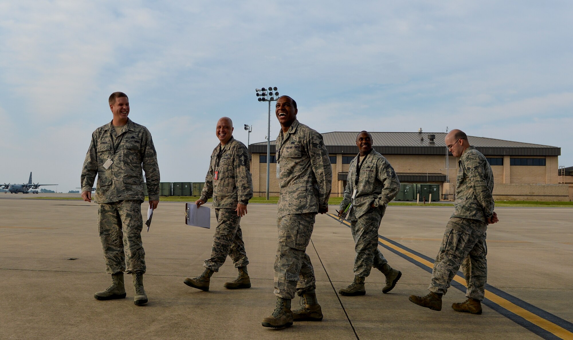Air Commandos relax after judging a Dedicated Crew Chief competition on Hurlburt Field, Fla., Aug. 1, 2014. Senior Airman Matthew Campbell, 1st Special Operations Aircraft Maintenance Squadron DCC (middle) was being judged on his knowledge and professionalism. (U.S. Air Force photo/Senior Airman Christopher Callaway) 