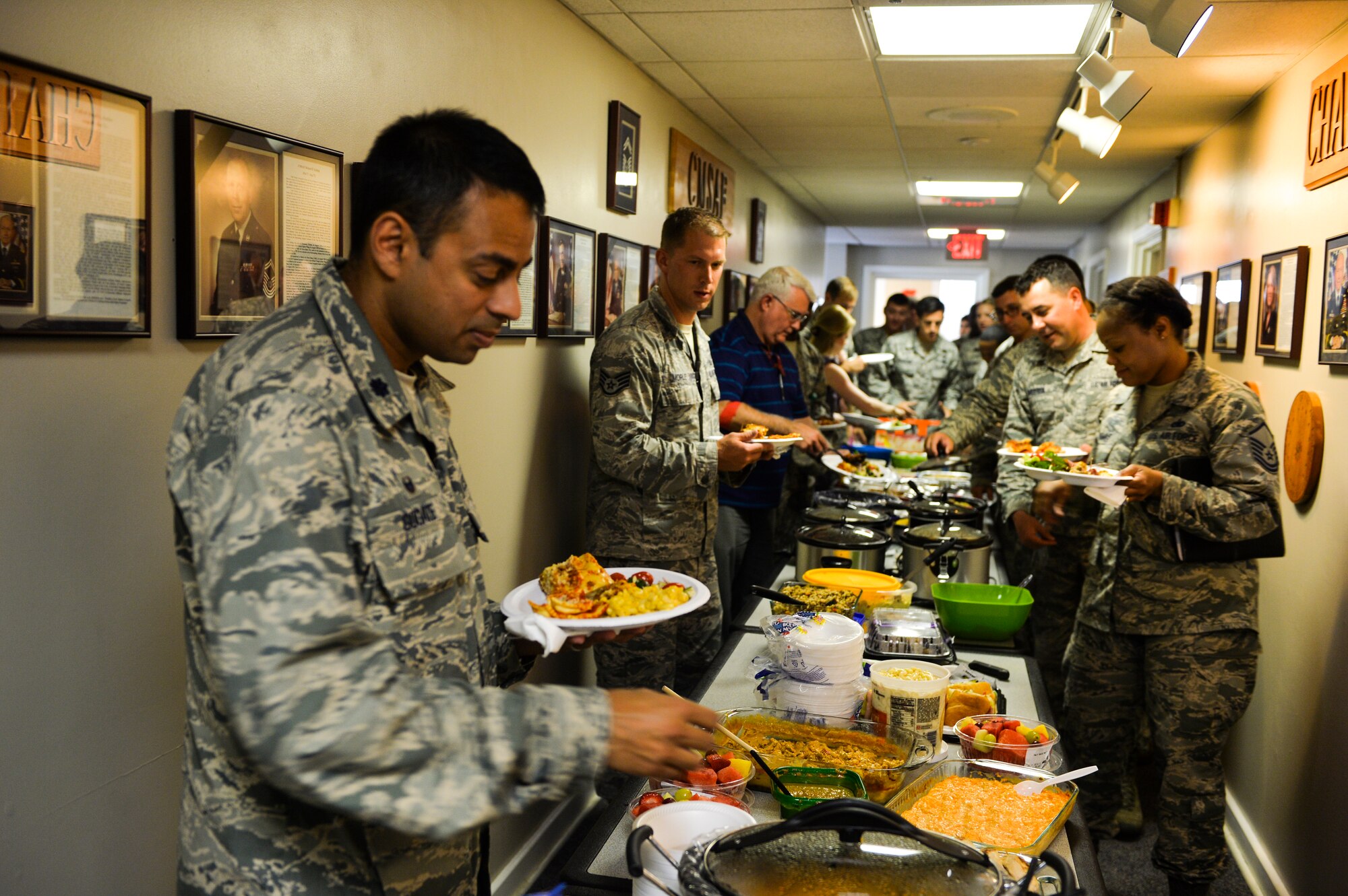 Lt. Col Sanjay Gogate, 1st Special Operations Aerospace Medicine Squadron commander, prepares a plate of food at the Airmen Leadership School House on Hurlburt Field, Fla., August 5, 2014. ALS students hosted a diversity lunch that consisted of food representing their ethnic backgrounds. (U.S. Air Force photo/Senior Airman Christopher Callaway) 