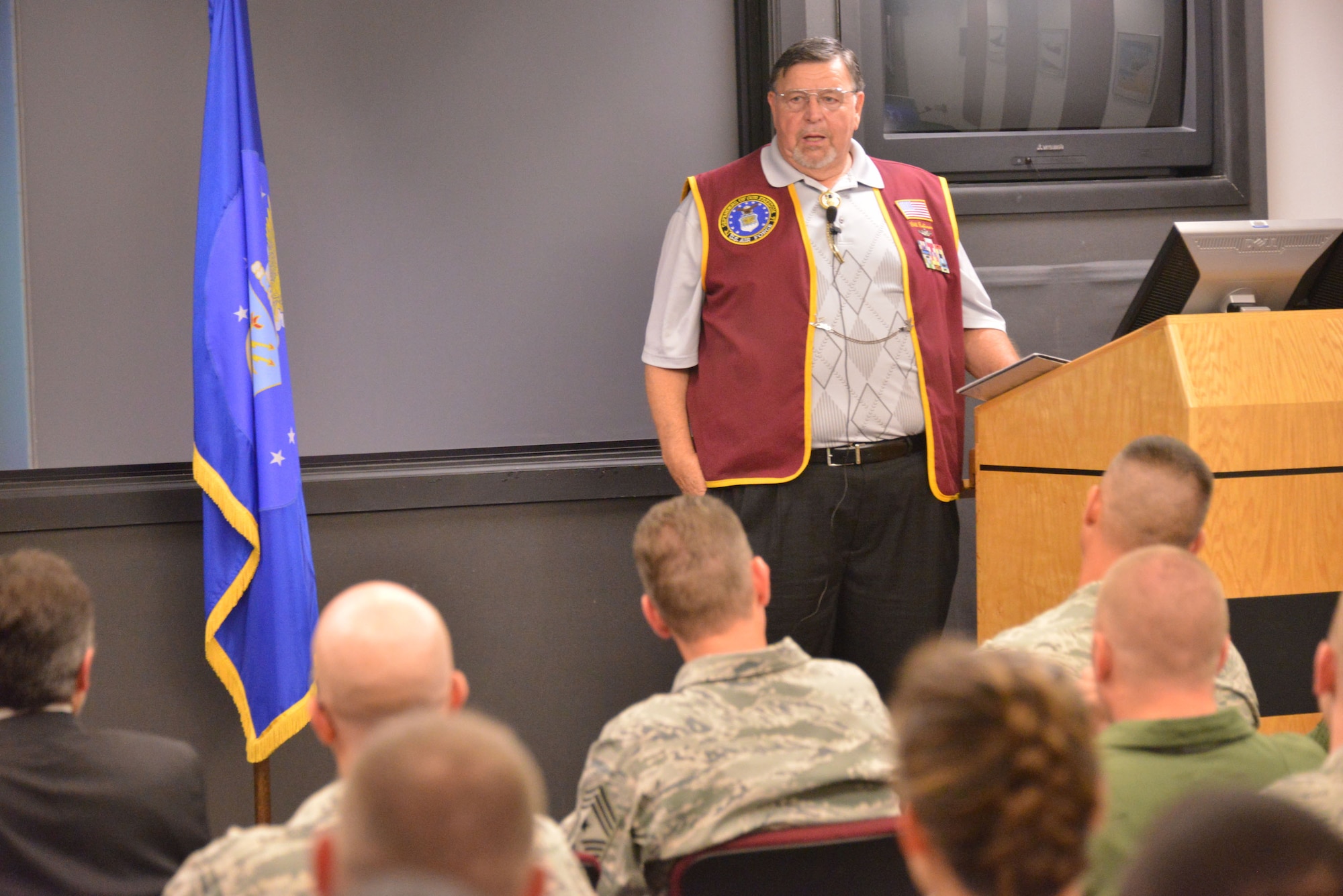 Retired Air Force captain and former Vietnam POW William Robinson addresses Kirtland Airmen. Robinson gave two talks, sharing his experiences during seven years of captivity.(Photo by Todd Berenger)