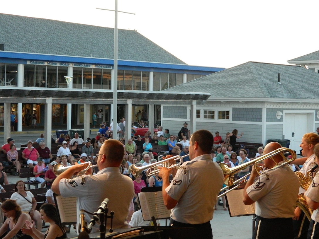 Members of High Altitude perform for an enthusiastic crowd at Hampton Beach, NH on June 30, 2014.  High Altitude was one of several different ensembles which performed on the Ocean front stage for hundreds of audience members.  (U.S. Air Force Photo/Technical Sgt. Dawn Hoffman)