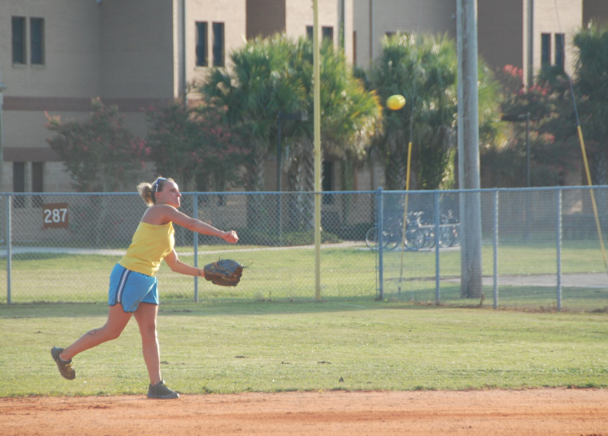 101st Air Operations Group player Karrie Warren throws the ball infield for a play during the Tyndall Intramural Softball Championship game August 5. (Photo by Capt. Jared Scott)