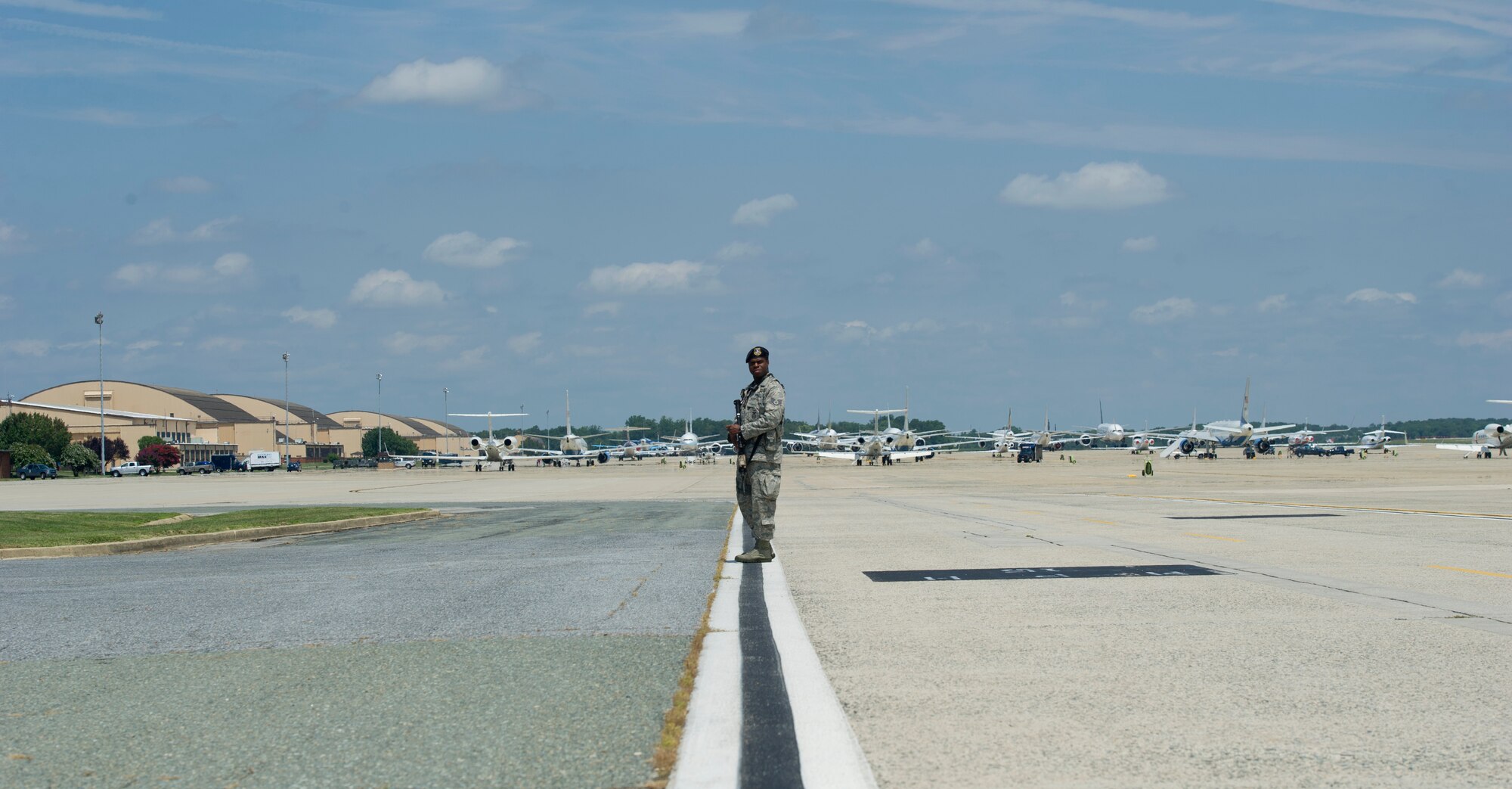 Staff Sgt. Timon Alvin, 811th Security Forces entry controller, stands guard as Joint Base Andrews welcomes U.S.-Africa Leaders Summit dignitaries at JBA, Md., Aug. 3, 2014. Team Andrews served as a critical component to ensuring more than 20 distinguished visitors’ safe arrivals and departures. (U.S. Air Force photo/ Senior Airman Nesha Humes)