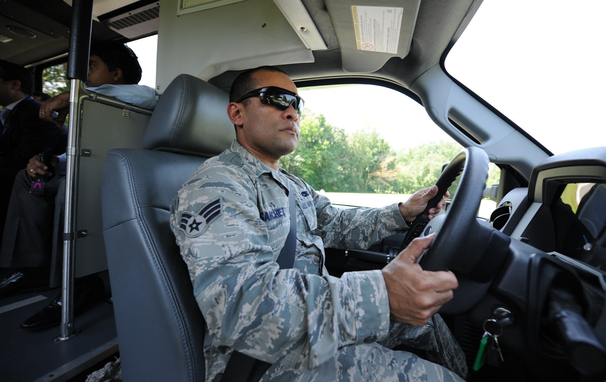 Senior Airman Juan Sanchez, 11th Logistics Readiness Squadron vehicle operator, drives a bus to help escort foreign media personnel on Joint Base Andrews, Md., Aug. 3, 2014. Team Andrews served as a critical component to ensure dignitaries’ safe arrivals and departures for the U.S.-Africa Leaders Summit in Washington D.C. (U.S. Air Force photo/ Senior Airman Nesha Humes)