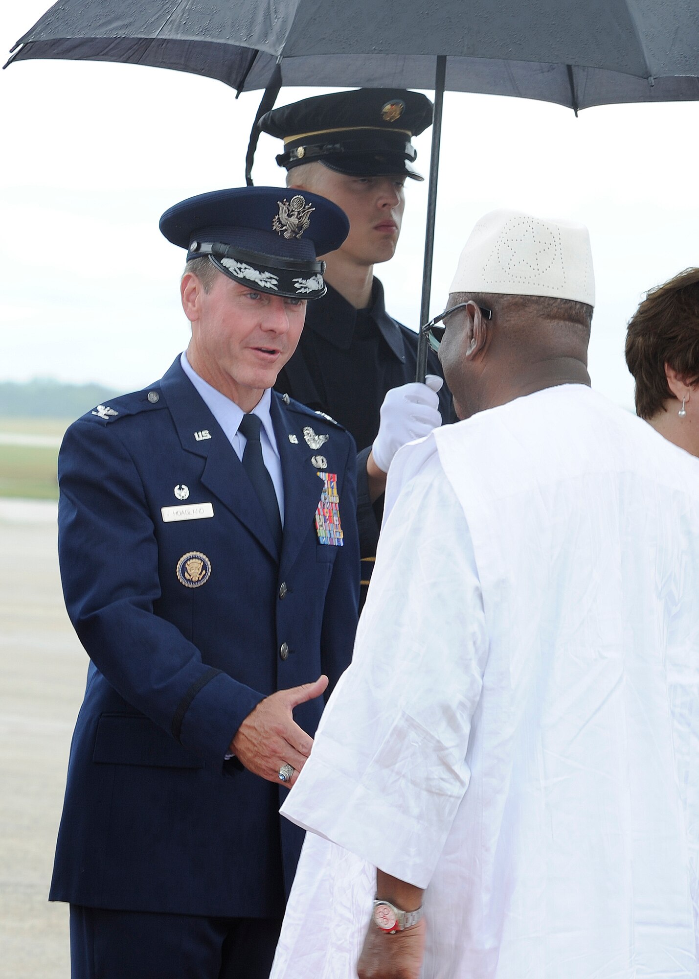 Colonel Brad Hoagland, 11th Wing and Joint Base Andrews commander, greets Ibrahim Boubacar Keita, the President of Mali, on the JBA flightline Aug. 3, 2014. The president arrived to attend the US - Africa Leaders Summit in Washington D.C. JBA members worked collaboratively with the Department of State, Secret Service and FAA, among others, to ensure the safe arrival and departure of more than two dozen distinguished visitors traveling to and from the summit via the airfield. (U.S. Air Force photo/Senior Airman Kat Lynn Justen)
