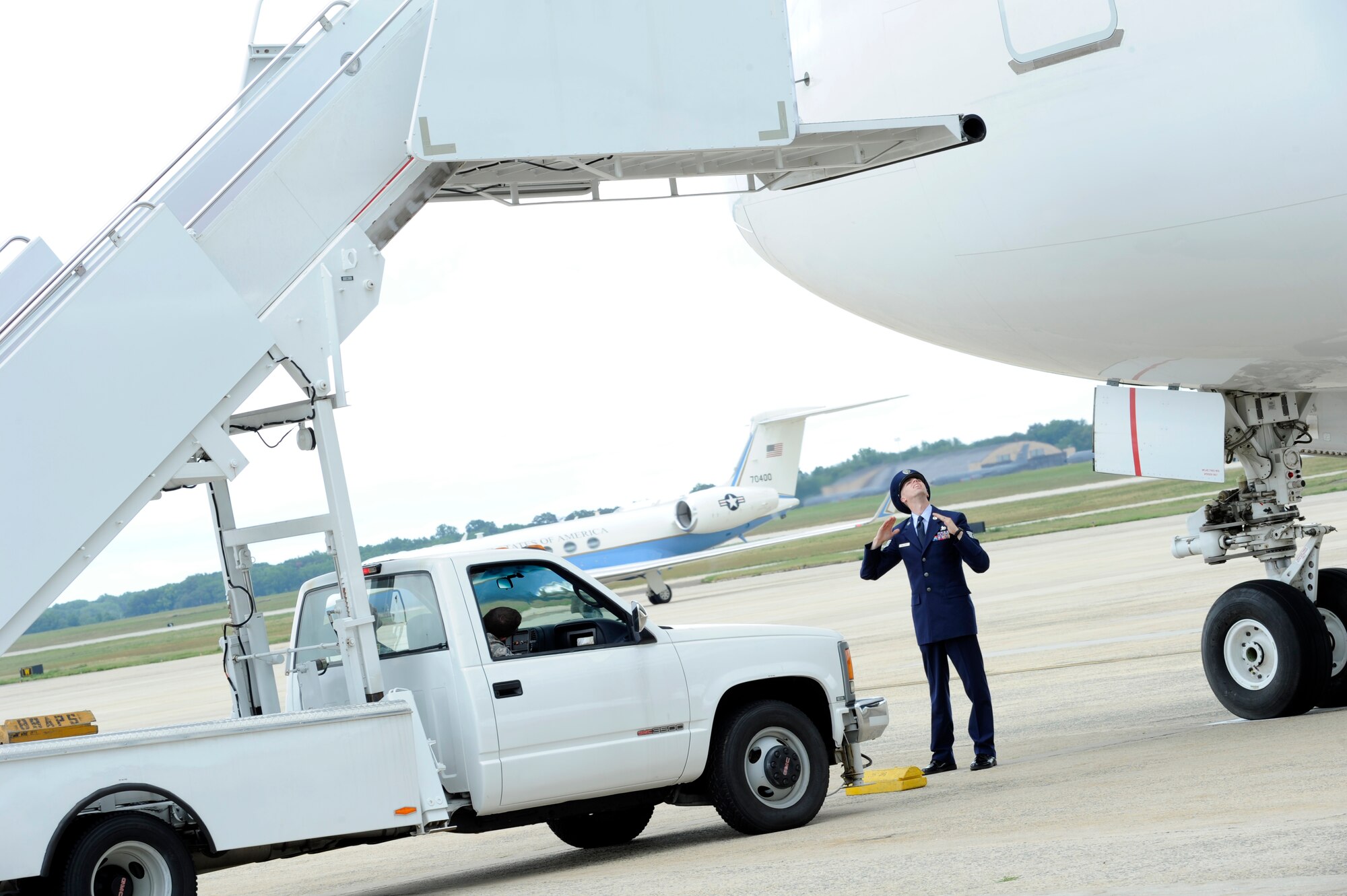 Staff Sgt. Casey R. Williams, 89th Aerial Port Squadron special air missions agent, spots a set of stairs to the door of an Boeing 767 carrying the President of Chad, Idriss Deby, on the Joint Base Andrews flightline Aug. 3, 2014. The president arrived to attend the US - Africa Leaders Summit in Washington D.C. JBA members worked collaboratively with the Department of State, Secret Service and FAA, among others, to ensure the safe arrival and departure of distinguished visitors traveling to and from the summit via the airfield.(U.S. Air Force photo/Senior Airman Kat Lynn Justen)