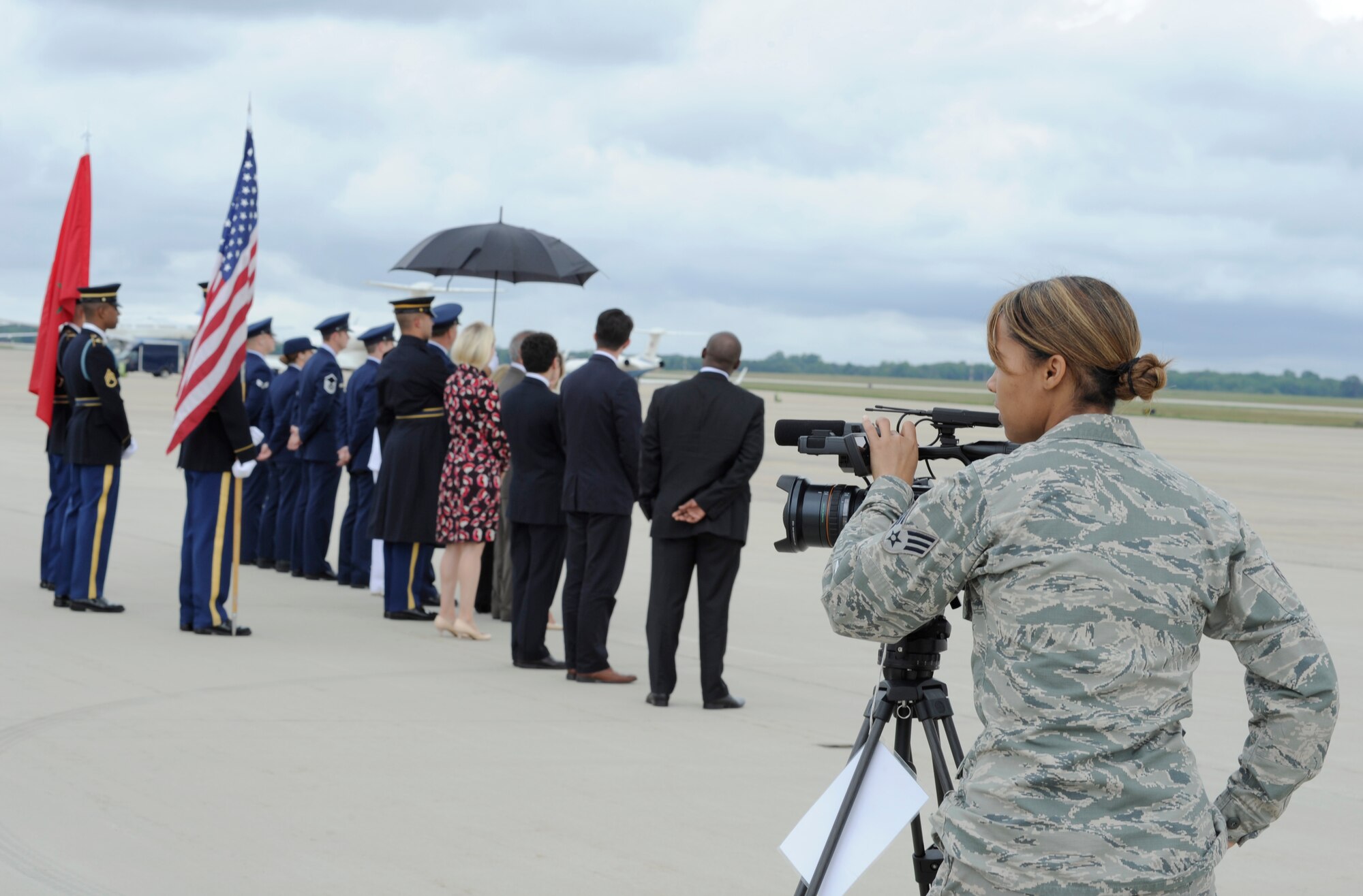 Senior Airman Terace E.C. Garnier, 11th Wing Public Affairs broadcaster, captures footage on the Joint Base Andrews flightline prior to the arrival of the Prime Minister of Morocco Aug. 3, 2014.  JBA members worked collaboratively with the Department of State, Secret Service and FAA, among others, to ensure the safe arrival and departure of more than two dozen distinguished visitors traveling to and from the US – Africa Leaders Summit in Washington D.C. via the airfield. (U.S. Air Force photo/Senior Airman Kat Lynn Justen)