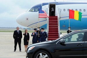 Members of Joint Base Andrews and the Department of State see off the motorcade carrying the Republic of Guinea President, Alpha Conde, on the JBA flightline Aug. 2, 2014. President Conde was making his way to the US - Africa Leaders Summit in Washington D.C. JBA members worked collaboratively with the Department of State, Secret Service and FAA, among others, to ensure the safe arrival and departure of distinguished visitors traveling to and from the summit via the airfield. (U.S. Air Force photo/Senior Airman Kat Lynn Justen)