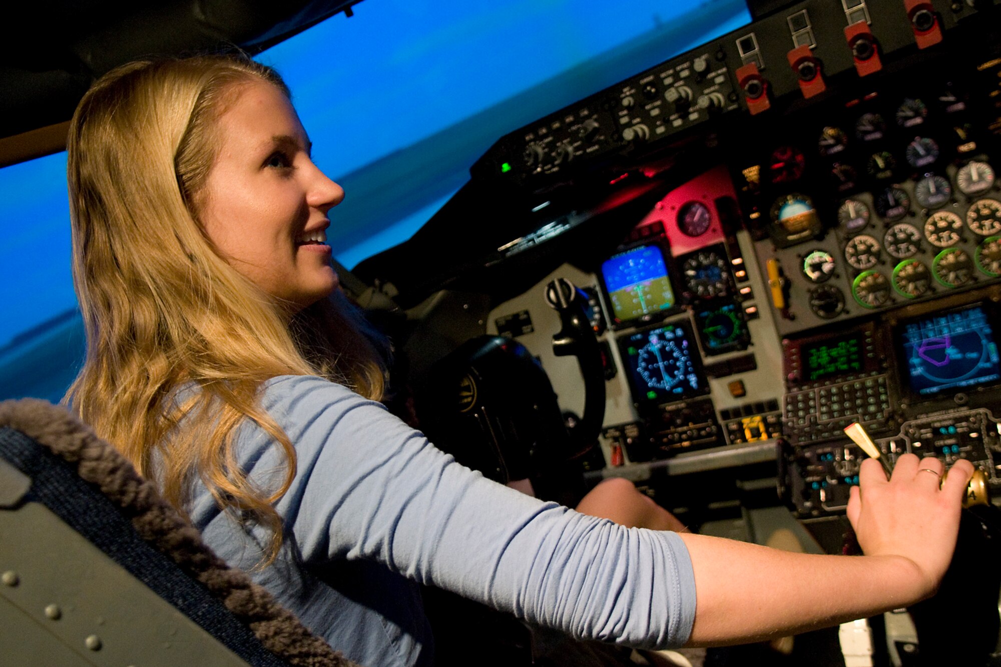 Molly Newell, legislative assistant for Rep. Luke Messer, experiences flight inside a KC-135R Stratotanker simulator during a visit to Grissom Air Reserve Base, Ind., August 1, 2014. Newell took a tour of Grissom to learn about the base and its mission. (U.S. Air Force photo/Tech. Sgt. Mark Orders-Woempner)