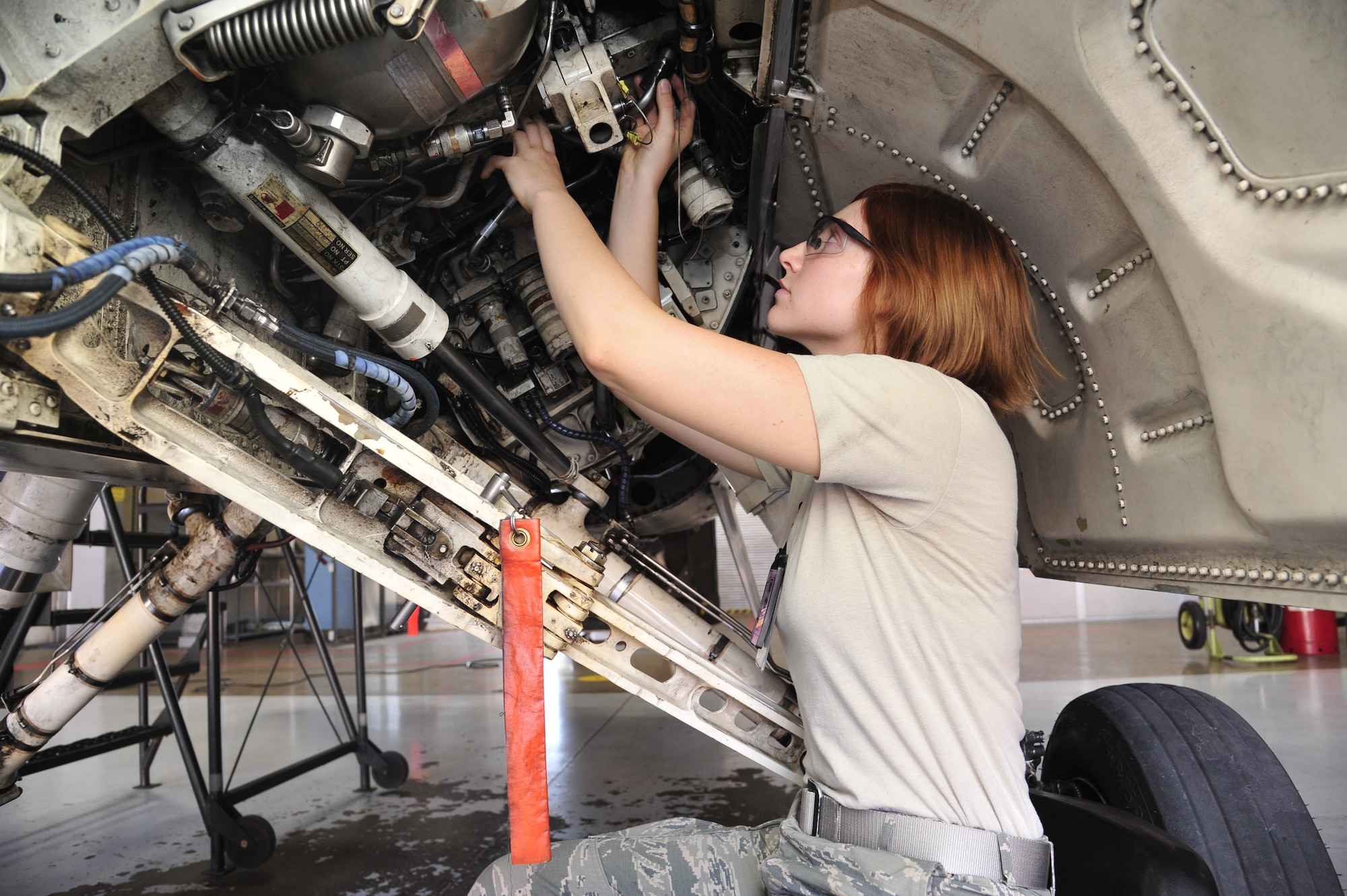 Senior Airman Jessica Reitano, 56th Equipment Maintenance Squadron aircraft structural maintenance journeyman, checks the swedge of a hydro line with a go-no-go gauge July 25 in Bldg. 985 at Luke Air Force Base. The swedge is checked to ensure there are no leaks in the line. (U.S. Air Force photo/Senior Airman Grace Lee)