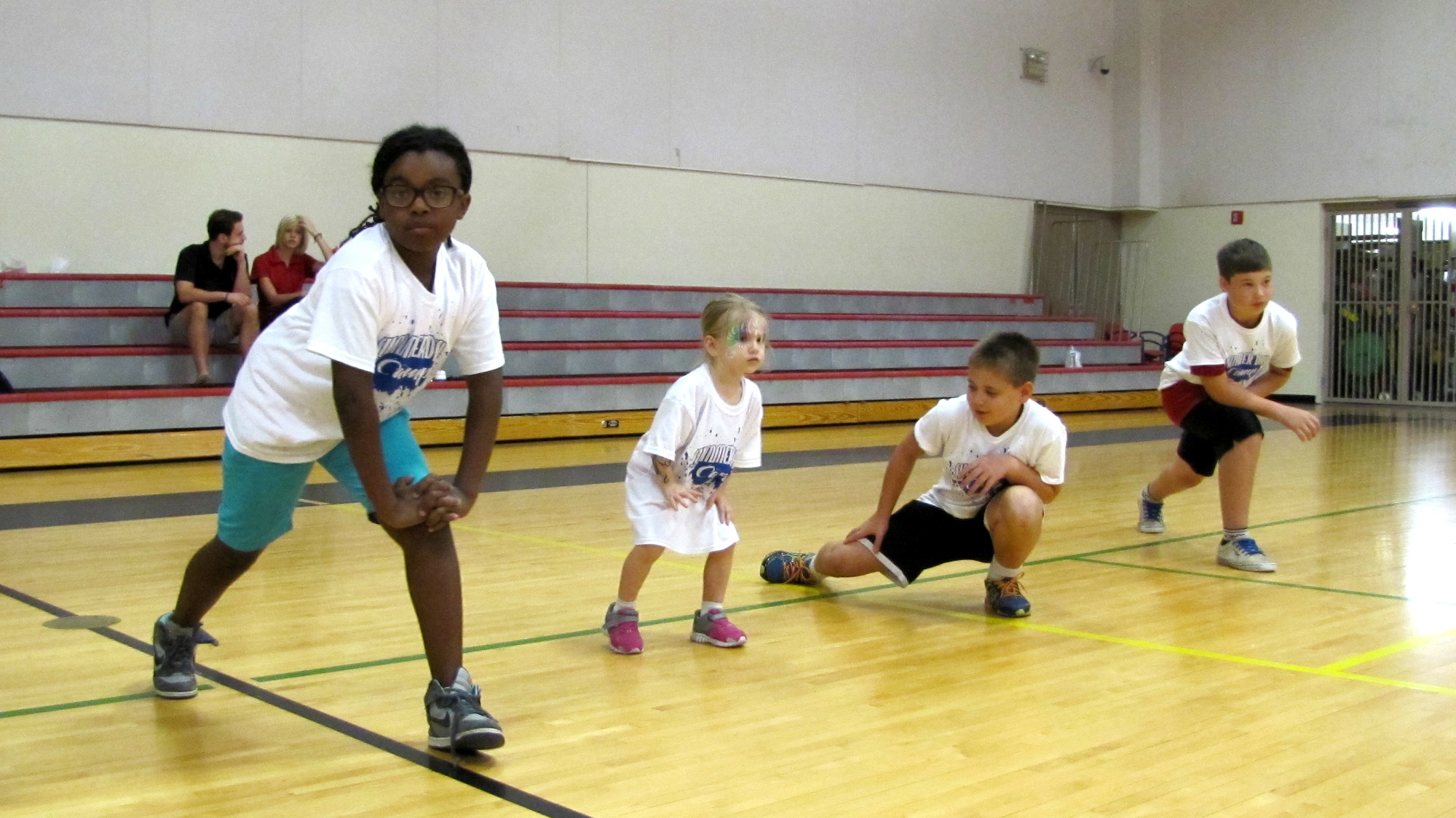 Children stretch Saturday during the Exceptional Family Member Program Summer Day Camp at the Luke Air Force Base Youth Center. The event provided a time for children to enjoy activities while parents learned about programs available to them. (Courtesy photo)