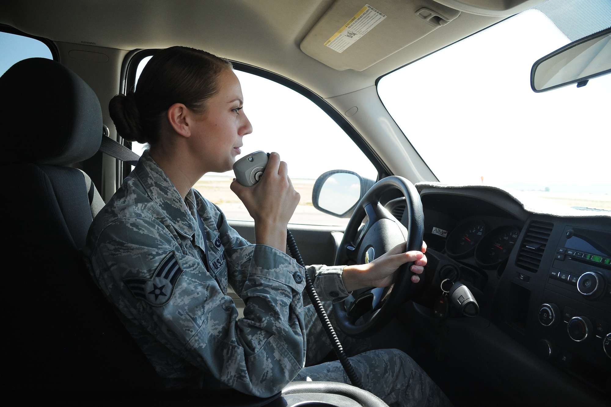 Senior Airman Monica Casanova, 56th Operation Support Squadron airfield management shift lead, requests permission from the tower to go onto the runway for a foreign object debris check. (U.S. Air Force photo/Airman 1st Class Pedro Mota)