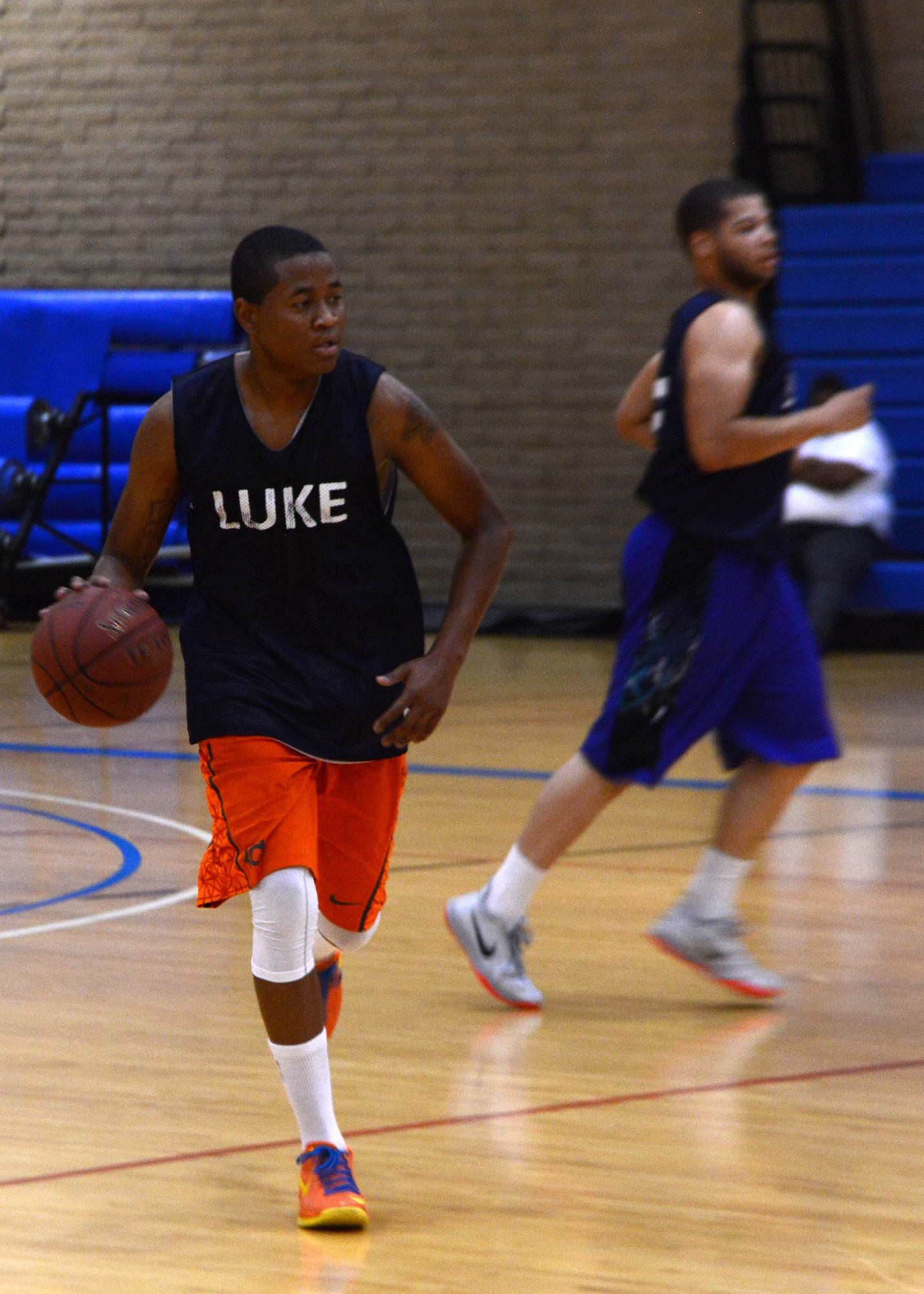Hanniel Julien, 56th Logistics Readiness Squadron, prepares to run a play during an intramural basketball game against 56th Operations Support Squadron July 29 in the Bryant Fitness Center at Luke Air Force Base. Julien poured in 20 points to lift LRS. (U.S. Air Force photo/Senior Airman Devante Williams)