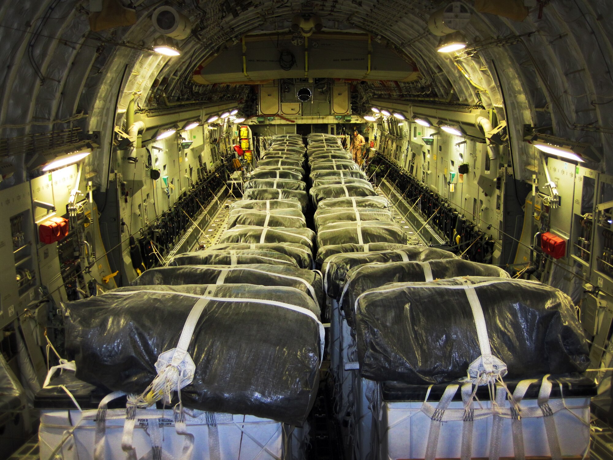 Water bundles loaded aboard a C-17 Globemaster III prior to a humanitarian airdrop over Iraq, Aug. 8, 2014. The 816th Expeditionary Airlift Squadron aircrew airdropped 40 bundles of water for displaced citizens in the vicinity of Sinjar, Iraq. (U.S. Air Force photo/Courtesy photo)