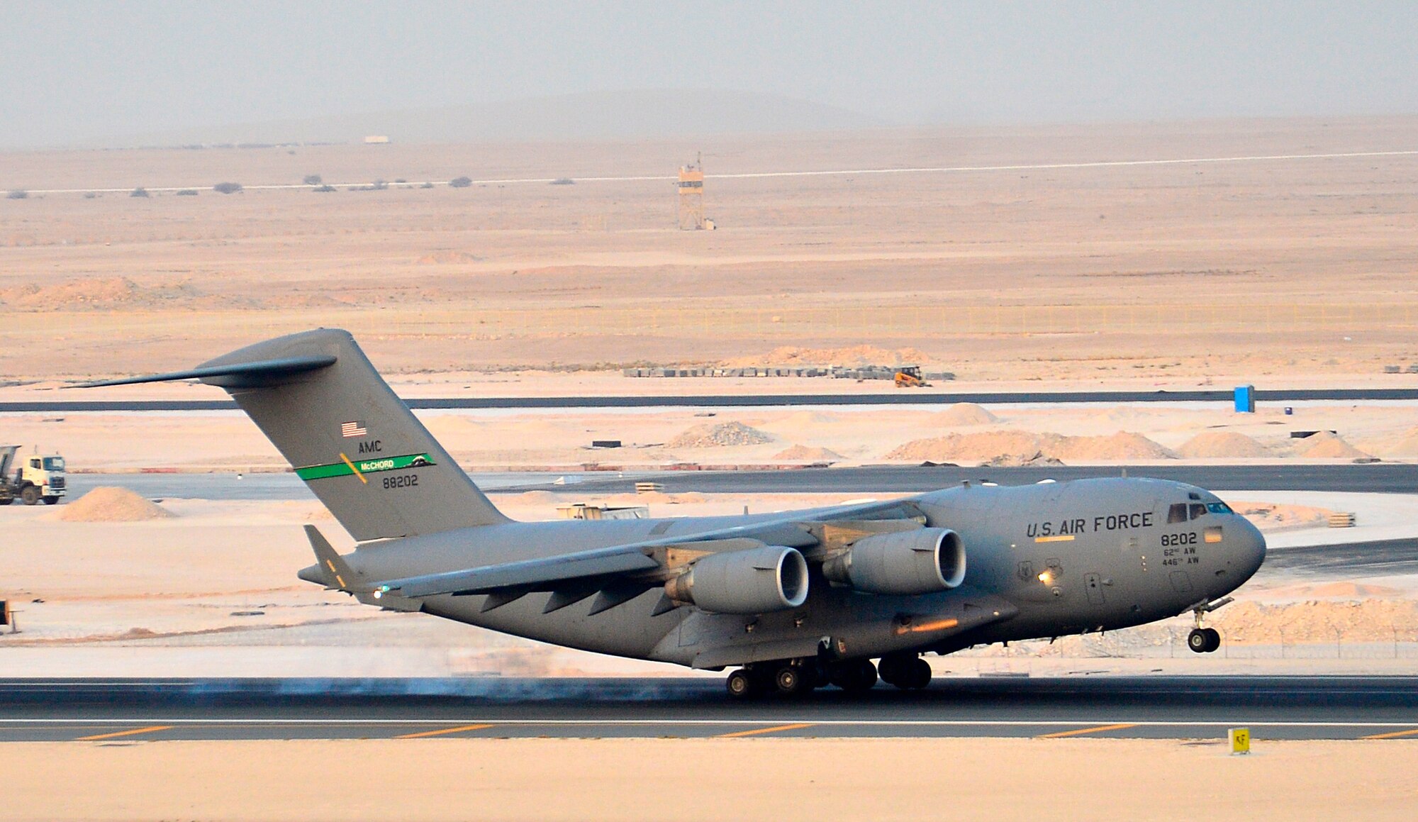 A C-17 Globemaster III lands Aug. 8, 2014, at a base in the U.S. Central Command area of responsibility. The aircrew dropped 40 bundles of water during a humanitarian airdrop to displaced Iraqi citizens in the vicinity of Sinjar, Iraq. (U.S. Air Force photo by Staff Sgt. Vernon Young Jr.)