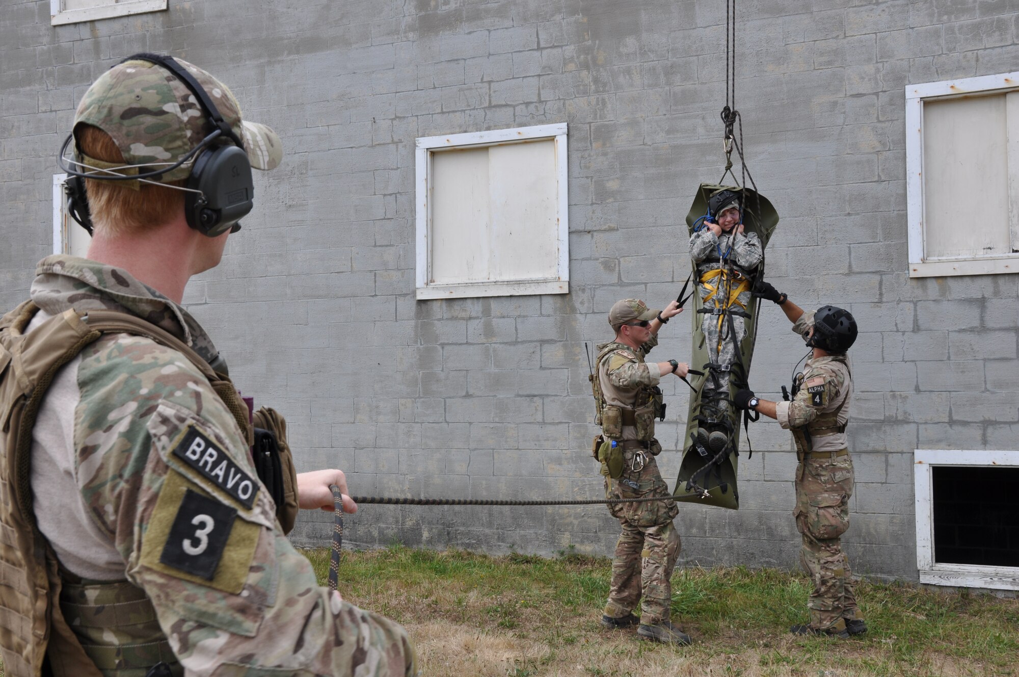 Reserve pararescuemen with the 304th Rescue Squadron, Portland Air National Guard Base, Ore., rescue a simulated casualty from a rooftop during Operation Pathfinder Minuteman Aug. 5, 2014 at Camp Rilea, Ore. Operation Pathfinder Minuteman was a joint disaster response exercise involving Air Force reservists, Air and Army National Guardsmen, and local, state federal civilian medical personnel. (U.S. Air Force photo/2nd Lt. Anna-Marie Wyant)