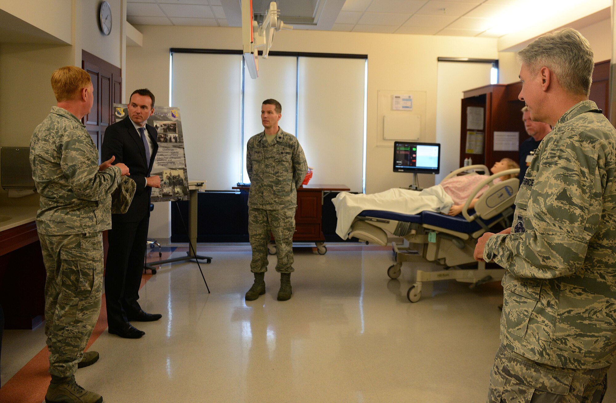 Col. Jeffrey Calder, 31st Medical Group commander, speaks with Under Secretary of the Air Force Eric Fanning about the MDG operations, Aug. 8, 2014, at Aviano Air Base, Italy. Fanning visited several squadrons, interacted with Airmen and hosted a base all-call. During the all-call, Fanning addressed topics such as budget, sequestration and the unique capabilities the Air Force brings to combatant commanders.  (U.S. Air Force photo/Airman 1st Class Deana Heitzman)