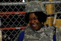 Paula Gold-Williams, 502nd Air Base Wing honorary commander, tries on body armor, July 2 at the Joint Base San Antonio-Randolph Del Torro Deployment Readiness Center.  The honorary commander program is intended to educate those with limited knowledge about the military or the installation while building relationships with members of the local community and encouraging those local civic leaders to share the Air Force story.  (U.S. Air Force photo by Airman 1st Class Stormy D. Archer)