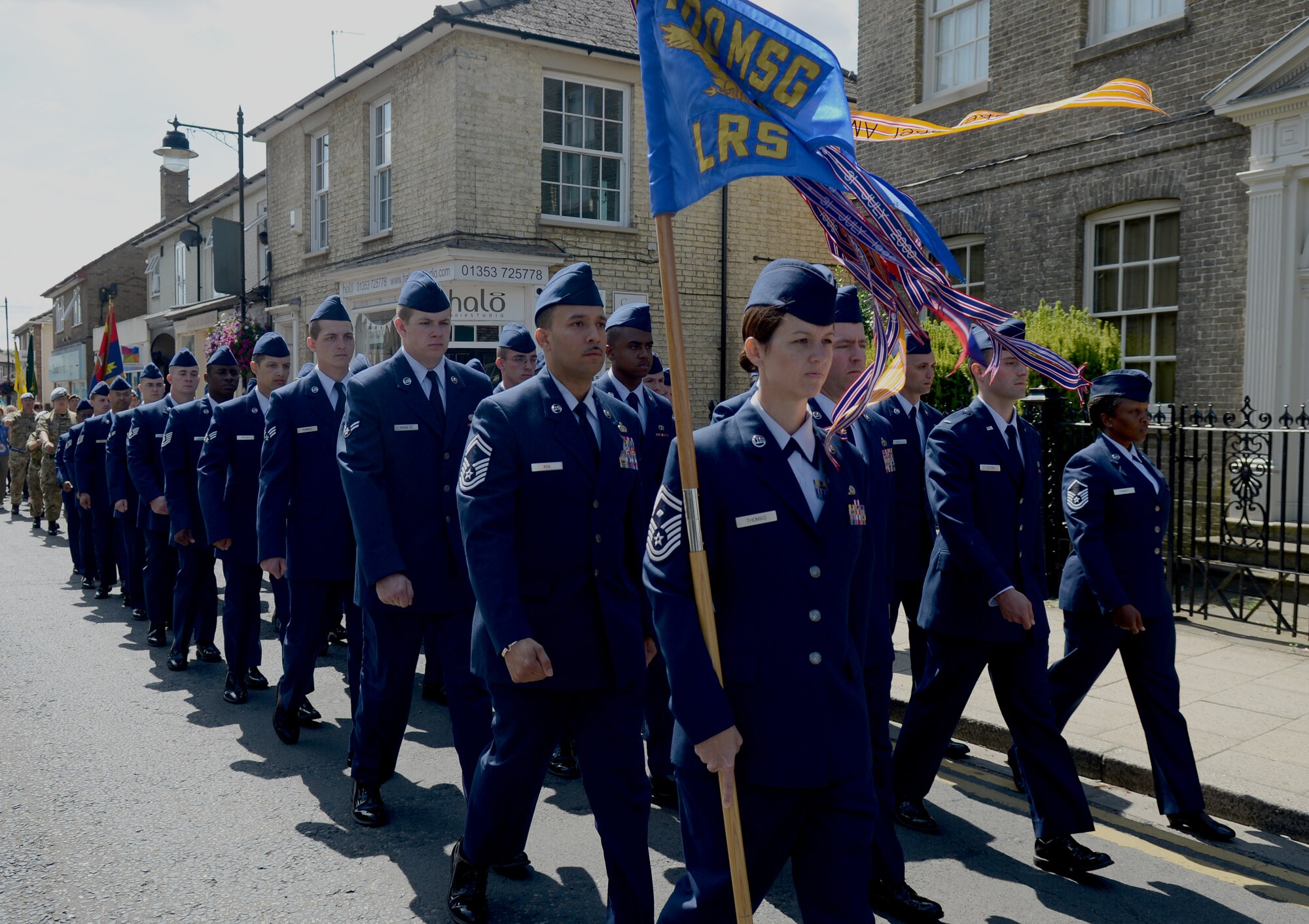 Members of the 100th Logistics Readiness Squadron march in a World War I memorial parade Aug. 3, 2014, in Soham, England. Marching along with the 100th LRS were members of the Royal British Legion, volunteers dressed in World War I uniforms, cadets and World War II veterans. (U.S. Air Force photo/Airman 1st Class Kyla Gifford/Released)