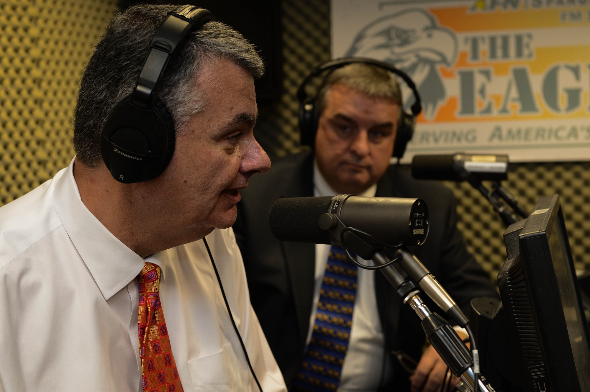 Robert Wallace, Veterans of Foreign Wars executive director, and Brian Duffy, VFW junior vice commander-in-chief, speak during a radio interview at American Forces Network Spangdahlem studio at Spangdahlem Air Base, Germany, Aug. 7, 2014. The leaders discussed Airman concerns regarding quality of life and veterans’ benefits. (U.S. Air Force photo by Airman 1st Class Kyle Gese/Released)