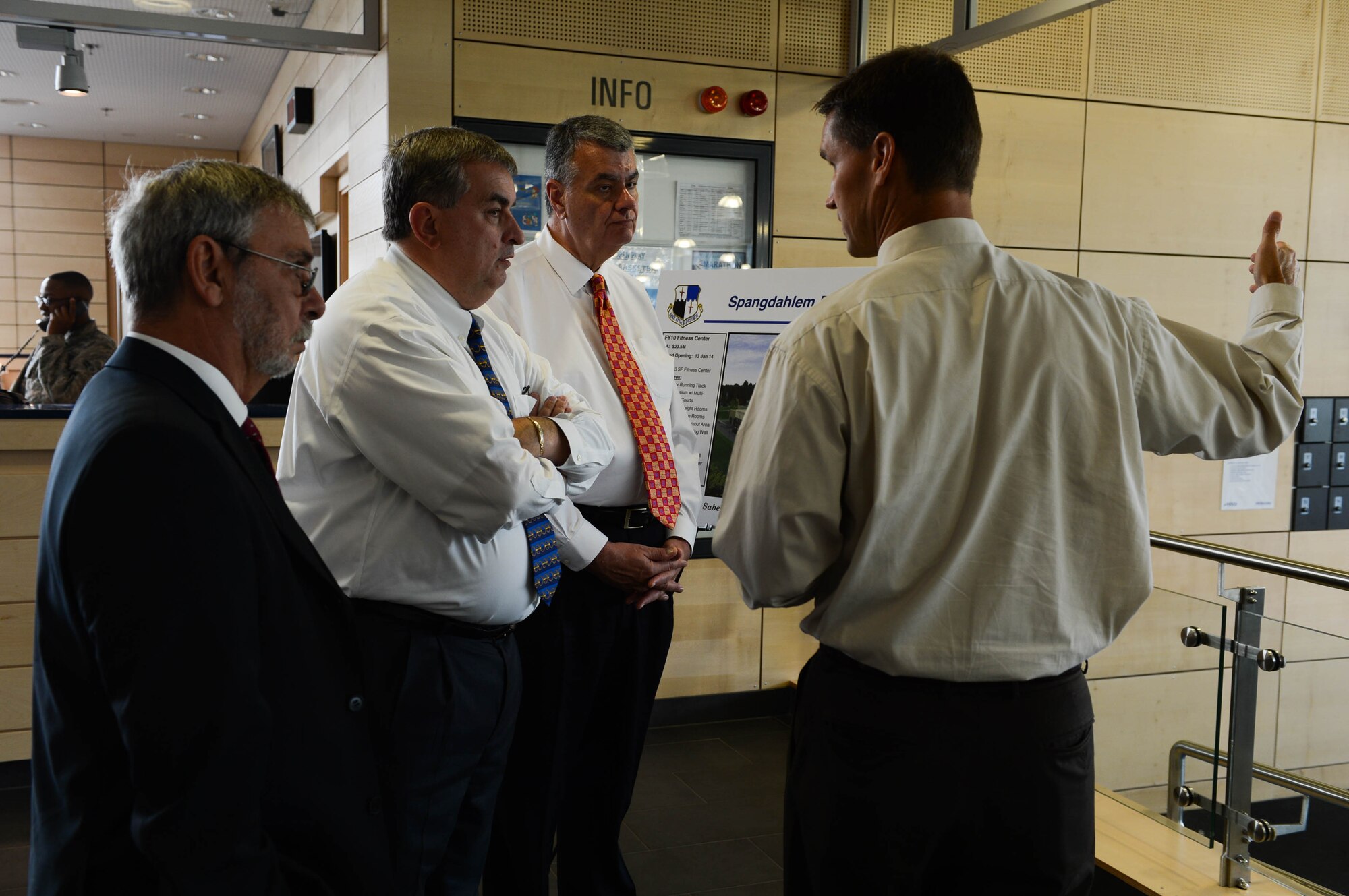 Jude Sorg, 52nd Force Support Squadron deputy director from Fort Wayne, Ind., talks about the Eifel Powerhaus fitness center with Veterans of Foreign Wars leadership at Spangdahlem Air Base, Germany, Aug. 7, 2014. Sorg showcased new equipment and space the facility provides to Airmen. (U.S. Air Force photo by Airman 1st Class Kyle Gese/Released)