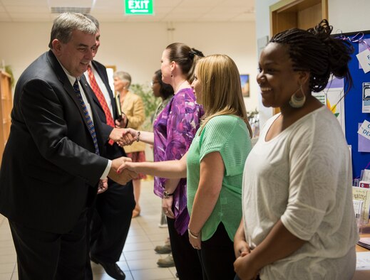 Brian Duffy, Veterans of Foreign Wars junior vice commander-in-chief, greets members of the Airman & Family Readiness Center at Spangdahlem Air Base, Germany, Aug. 7, 2014. VFW leaders toured the base and addressed issues such as budget cuts, quality of life and future benefits. (U.S. Air Force photo by Staff Sgt. Chad Warren/Released)
