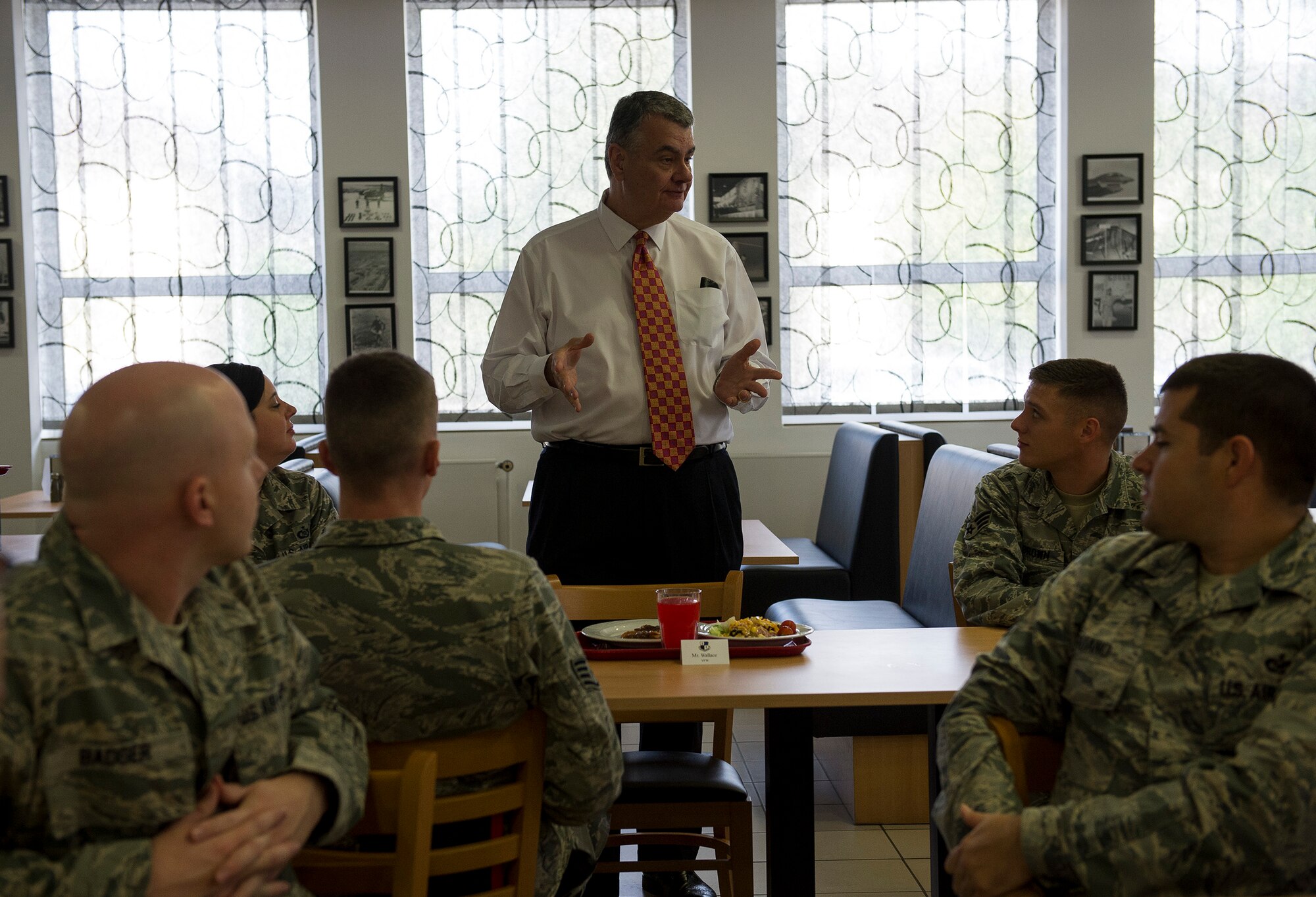 Robert Wallace, Veterans of Foreign Wars executive director, speaks to Airmen during lunch at Spangdahlem Air Base, Germany, Aug. 7, 2014. Wallace and Brian Duffy, VFW junior vice commander-in-chief, toured Spangdahlem as part of a VFW visit to learn about quality of life and other issues facing veterans today. (U.S. Air Force photo by Staff Sgt. Chad Warren/Released)