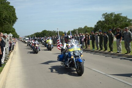 A motorcycle escort for the remains of United States Army Spc. Donnell A. Hamilton, Jr., was given July 30 at Joint Base San Antonio-Randolph. Hamilton was assigned to the 1st Battalion, 5th Cavalry Regiment, 2nd Brigade Combat Team, 1st Cavalry Division at Fort Hood, Texas. He died from an illness acquired while serving in Ghanzi Province, Afghanistan. (U.S. Air Force photo by Joel Martinez)

