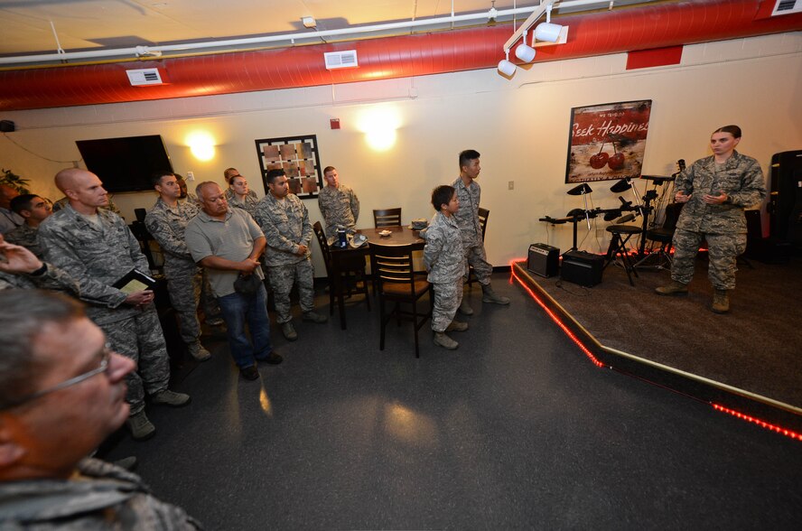 Second Lt. Amela Kamencic, 28th Civil Engineer Squadron environmental project manager, speaks with Airmen and squadron leaders during an open house event in the Higher Grounds Café at Ellsworth Air Force Base, S.D., July 31, 2014, to discuss new renovations. Airmen benefited from the new additions which included a new movie room, a chaplain’s office and a meeting room for Active Airmen Council meetings. (U.S. Air Force photo by Senior Airman Zachary Hada/Released)