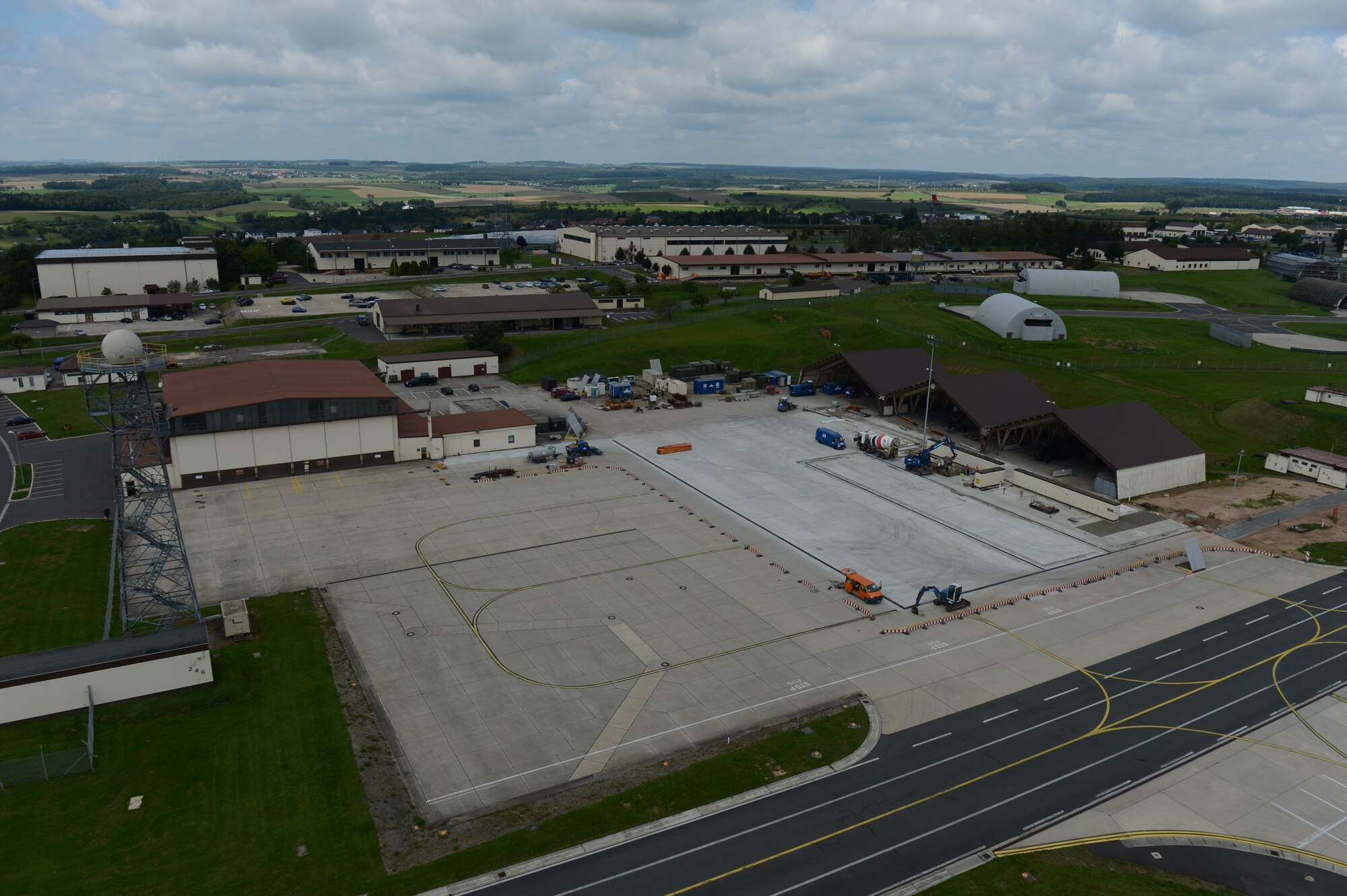 Construction continues on the flightline at Spangdahlem Air Base, Germany, Aug. 7, 2014. The construction will replace 90,400 square feet of concrete and cost approximately $2 million. (U.S. Air Force photo by Senior Airman Gustavo Castillo/Released)