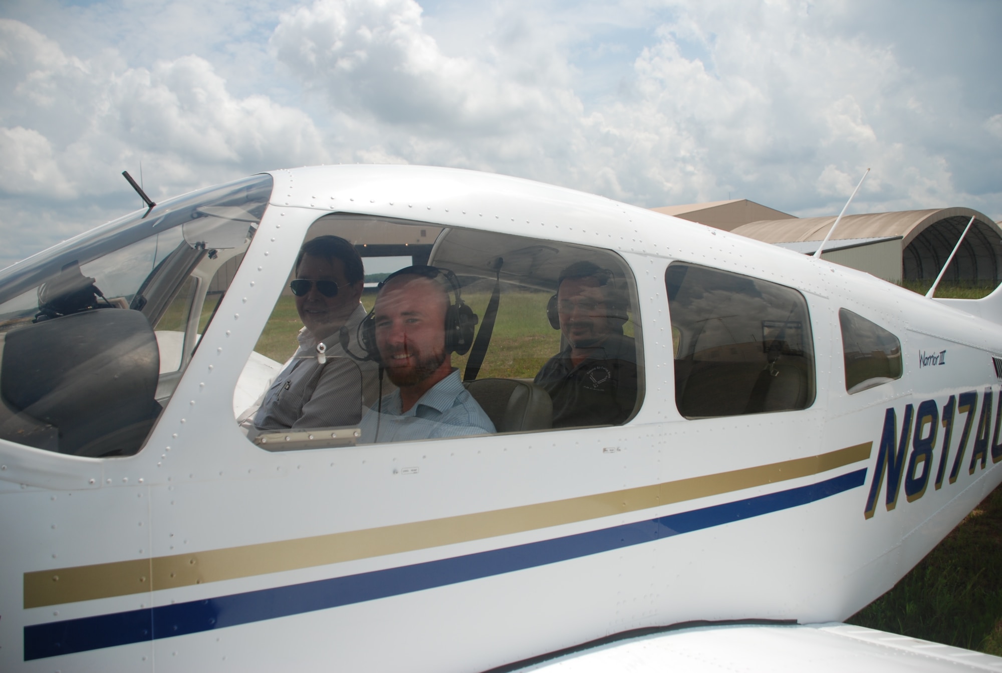 Brian Shreve, Rev-Up reporter, sits in a Piper Warrior III along with Lewayne Davis, Robins Aero Club chief flight instructor (left) and Paul Wenzel, Robins Public Affairs chief videographer (in the back seat), prior to take off. The Robins Aero Club was once limited to active duty personnel and Department of Defense civilians. On-base
flying lessons are now available to all Middle Georgia residents following a recent partnership between the club and the local community. Base and local residents interested in signing up for flying lessons at the Robins Aero Club should call (478) 926-4867.