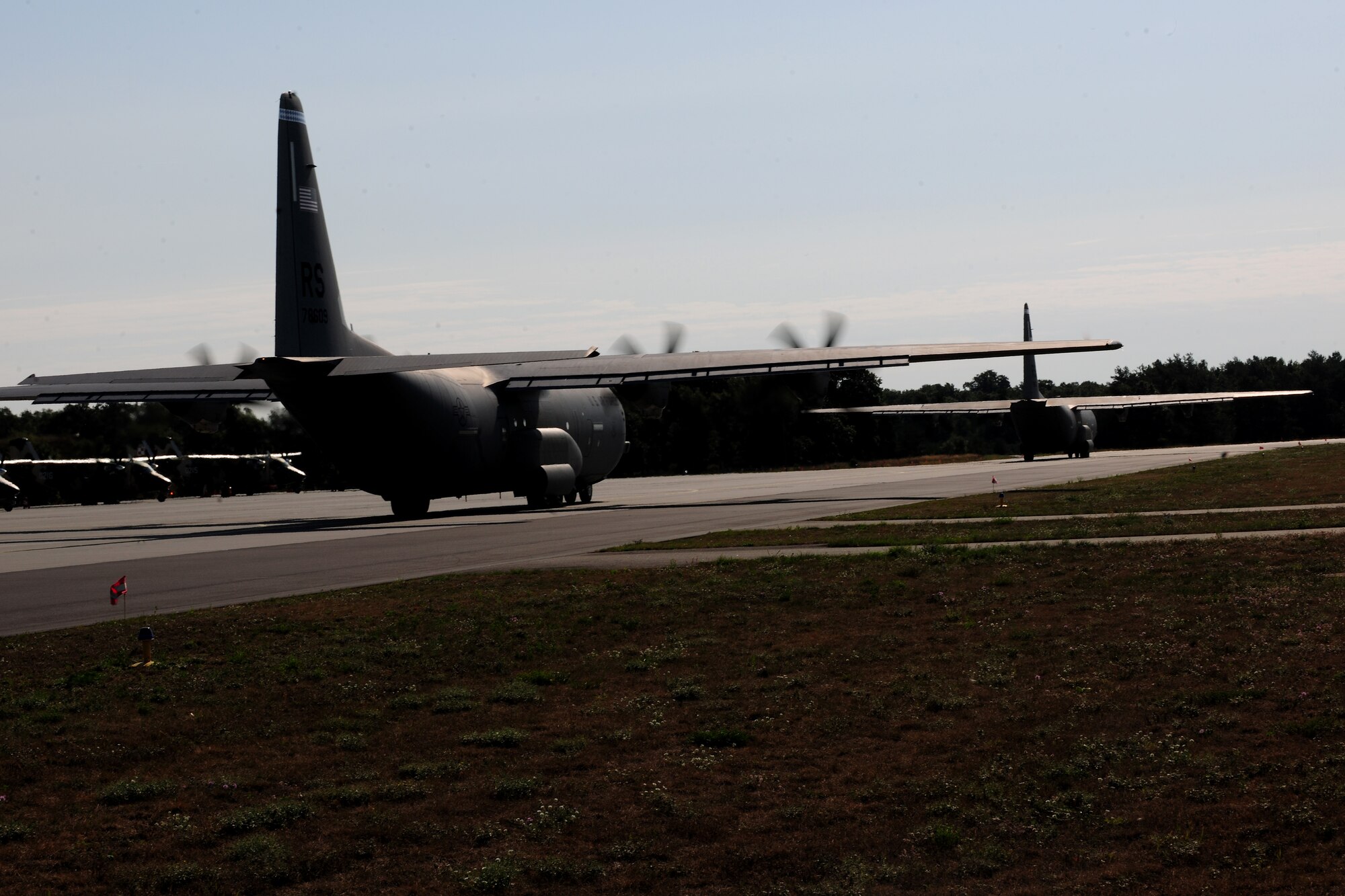 Two C-130J Super Hercules’ taxi down the flightline in preparation for takeoff at Powidz Air Base, Poland, Aug. 14, 2014. The aircraft, deployed from Ramstein Air Base, Germany, were part of bilateral training missions in support of Operation Atlantic Resolve. (U.S. Air Force photo by Staff Sgt. Jarad A. Denton/Released)