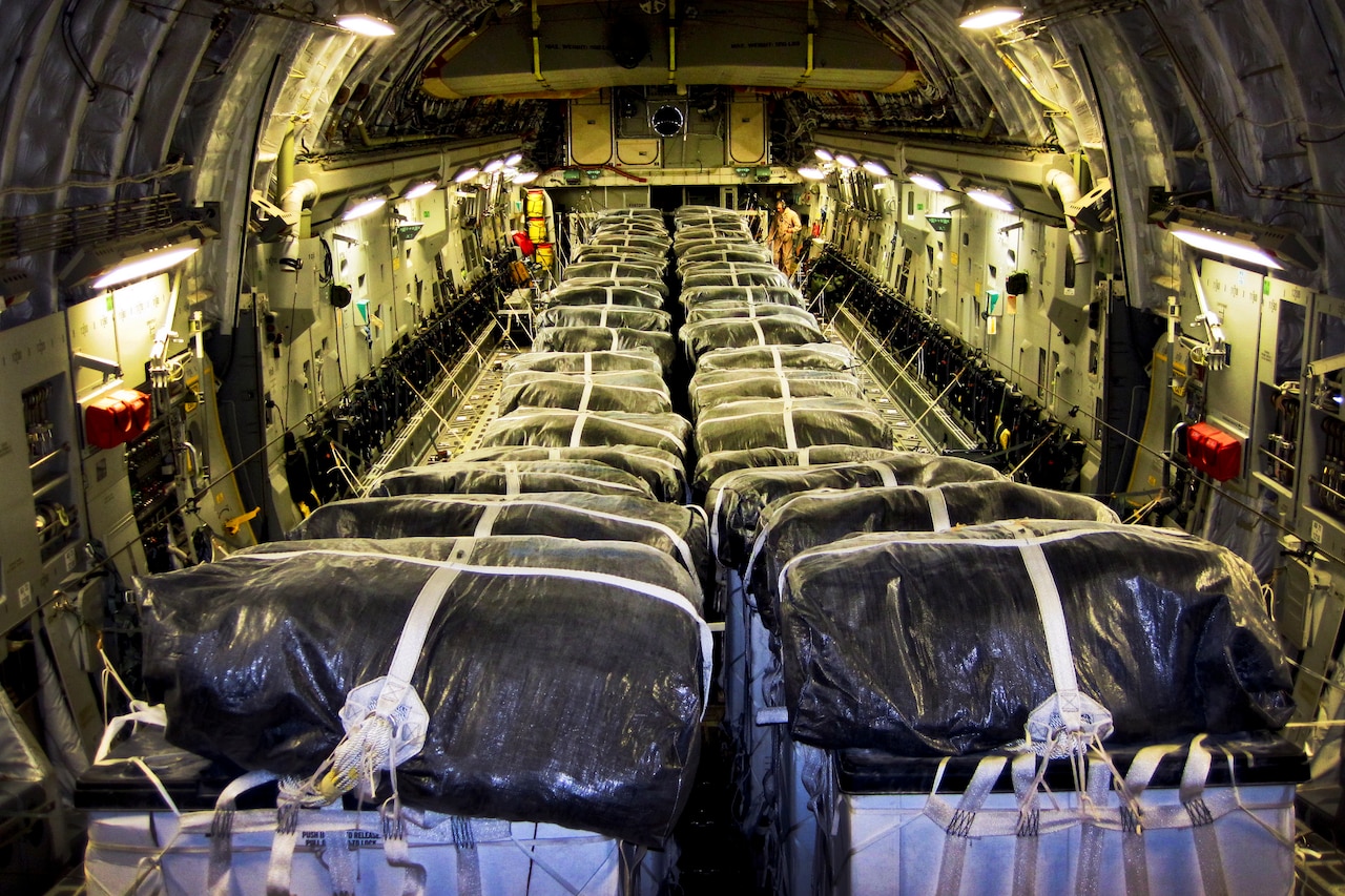 Straps secure water bundles aboard a C-17 Globemaster III before a humanitarian airdrop over Iraq, Aug. 8, 2014. The 816th Expeditionary Airlift Squadron aircrew airdropped 40 bundles of water for displaced citizens near Sinjar, Iraq. U.S. Air Force photo