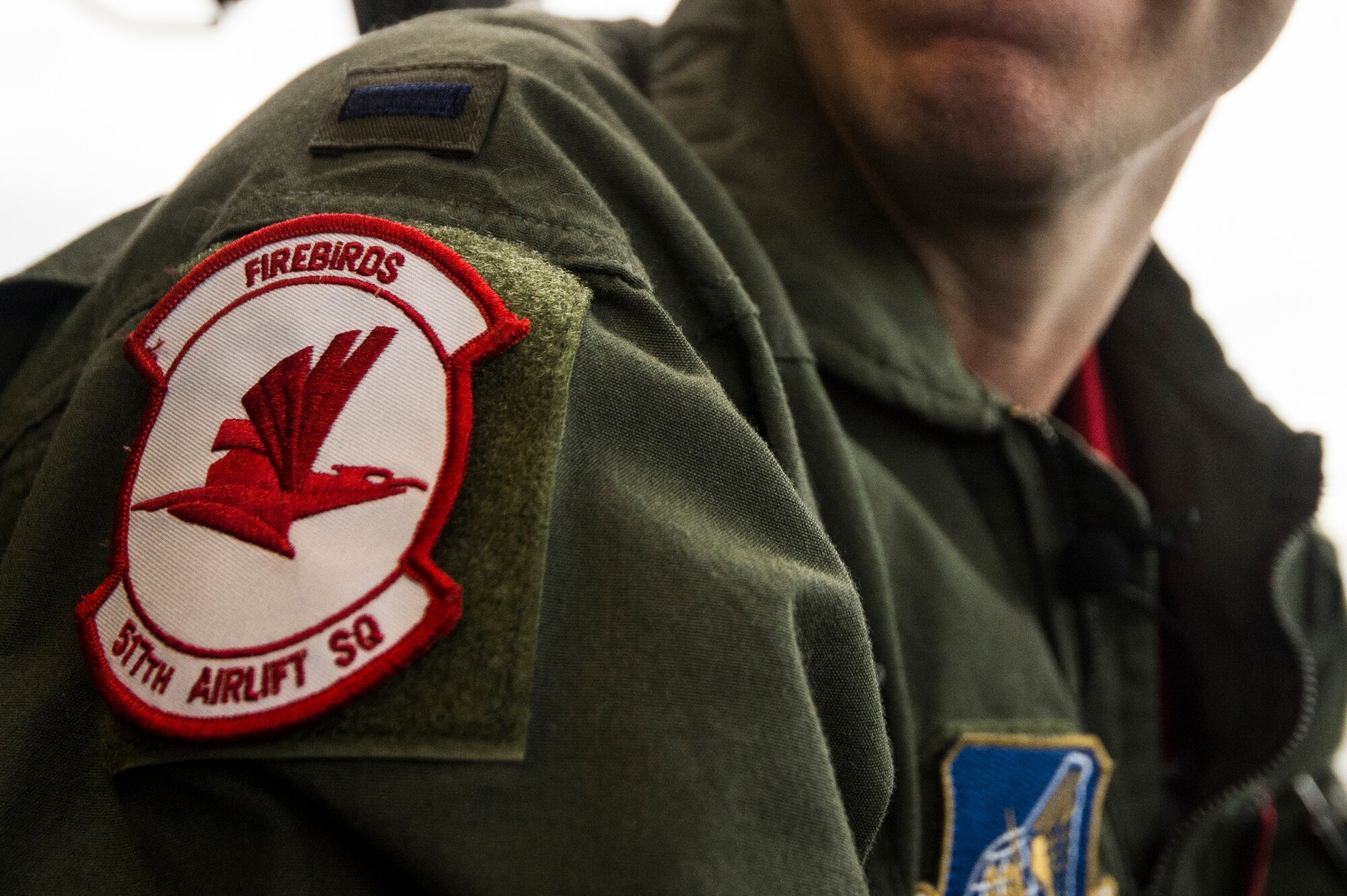 U.S. Air Force 1st Lt. Ryan Vesen, 517th Airlift Squadron pilot, answers questions from U.S. Army Staff Sgt. Christopher Taylor, 4-25 Airborne Brigade Combat Team, inside a C-17 Globemaster III at Joint Base Elmendorf- Richardson, Alaska, Aug. 8, 2014. The 517th AS was showing support for local Army jumpers by giving them a tour of the aircraft and answering questions. (U.S. Air Force photo by Staff Sgt. Stephany Richards/ Released)