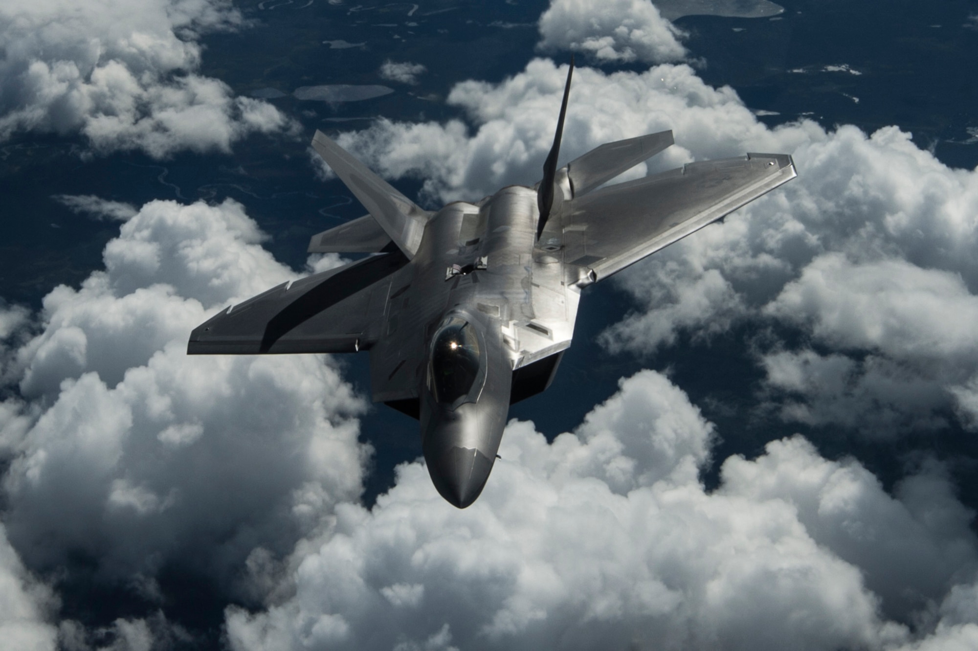 An F-22 Raptor from the U.S. Air Force 525th Fighter Squadron performs a refueling mission with a KC-135 Stratotanker from McConnell Air Force Base, Kan., outside of Joint Base Elmendorf-Richardson, Alaska, during a training mission, Aug. 7, 2014.  The F-22 is designed to project air dominance, rapidly and at great distances. (U.S. Air Force photo by Staff Sgt. Stephany Richards/ Released)