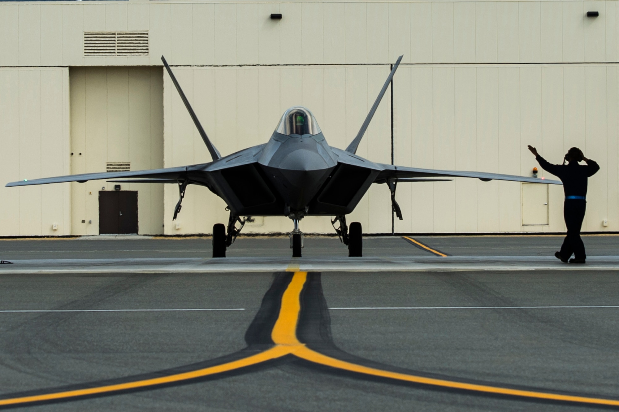 U.S. Air Force Airman 1st Class Marlon Kellywood, 3rd Maintenance Squadron crew chief, inspects the cockpit of an F-22 Raptor after a training mission at Joint Base Elmendorf-Richardson, Alaska, Aug. 6, 2014.  The F-22 is designed to project air dominance rapidly and at great distances. (U.S. Air Force photo by Staff Sgt. Stephany Richards/ Released)