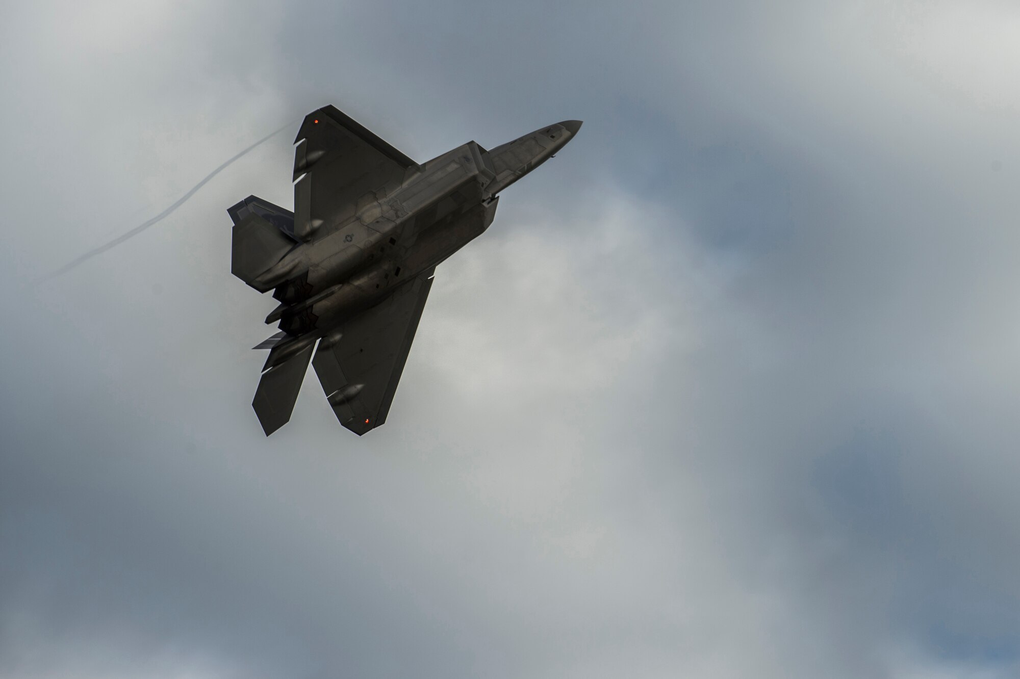 A U.S. Air Force F-22 Raptor from the 525th Fighter Squadron performs a touch-and-go on the Joint Base Elmendorf-Richardson, Alaska, flightline during a training mission, Aug. 6, 2014.  The F-22 is designed to project air dominance rapidly and at great distances. (U.S. Air Force photo by Staff Sgt. Stephany Richards/ Released)