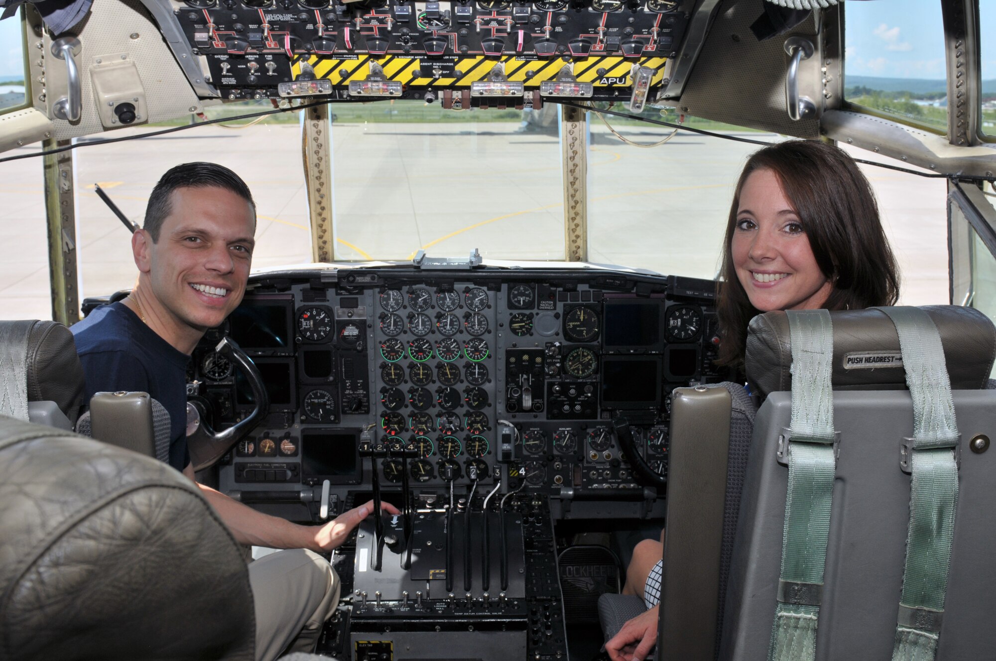 Assemblyman Angelo Santabarbara, 111th District, and Amy Amoroso, New York State Director of Veterans Business Outreach, sit in the cockpit of an LC-130 Skibird during a tour at Stratton Air National Guard Base, Scotia, New York, on Aug. 9, 2014.  (U.S. Air National Guard photo by Staff Sgt. Benjamin German/Released)
