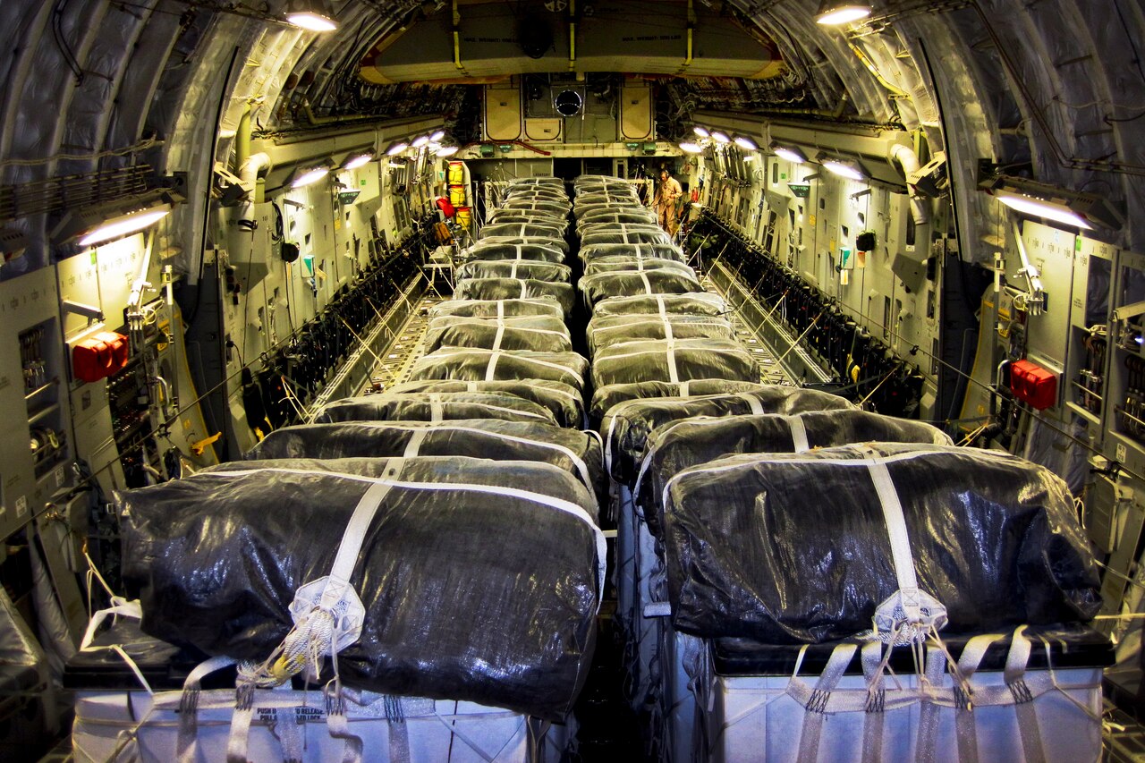 Straps secure water bundles aboard an Air Force C-17 Globemaster III before a humanitarian airdrop over Iraq, Aug. 8, 2014. The 816th Expeditionary Airlift Squadron aircrew airdropped 40 bundles of water for displaced citizens near Sinjar, Iraq. U.S. Air Force photo