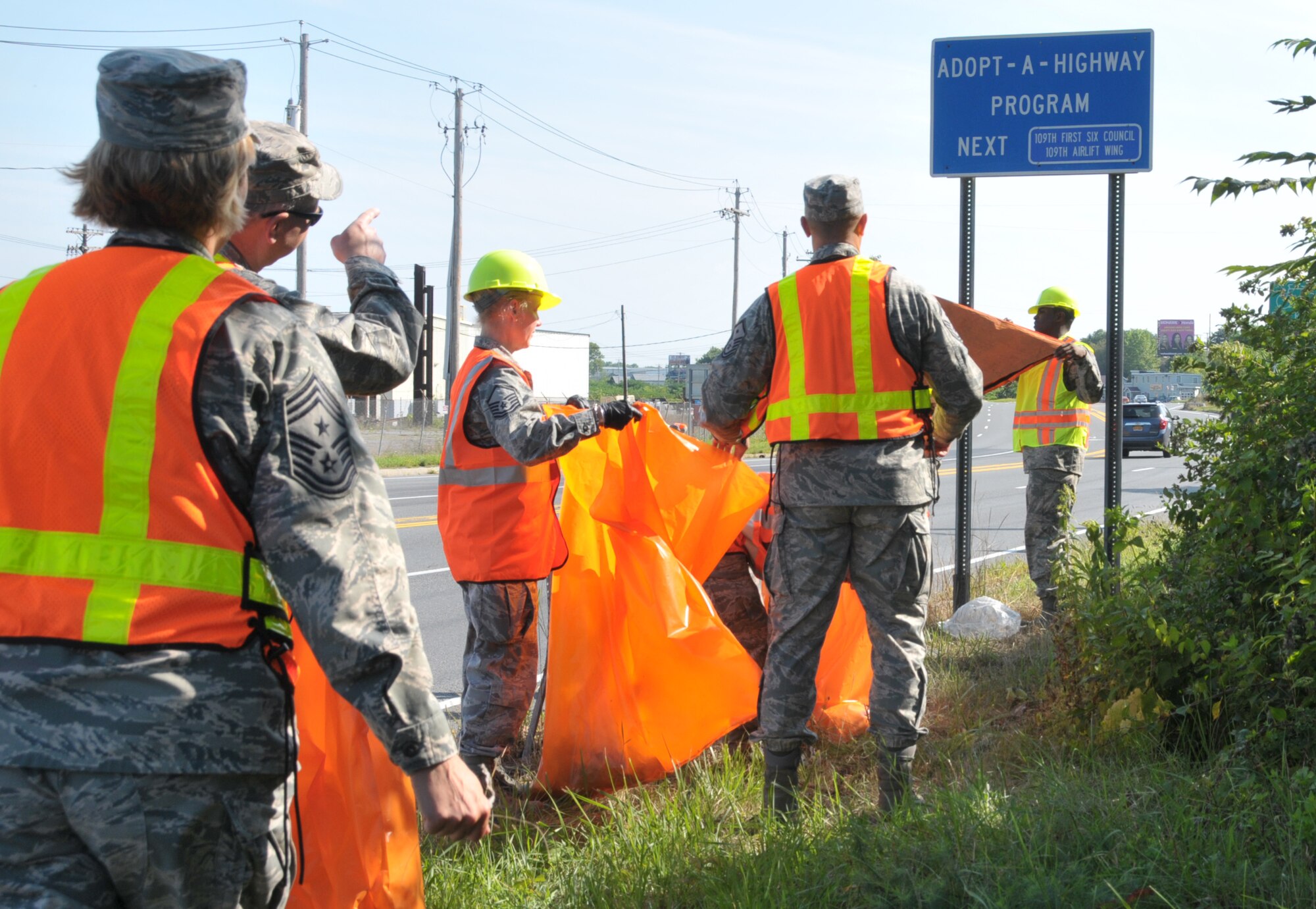 Airmen with the 109th Airlift Wing participated in the Adopt-A-Highway program in Schenectady, New York, on Aug. 10, 2014. The First Six Council planned the event to clean up the Wing's neighboring community and will be out four times a year. (U.S. Air National Guard photo by Tech. Sgt. Catharine Schmidt/Released)